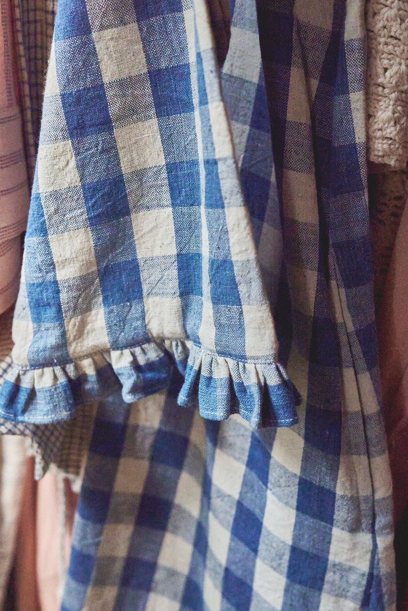 Blue checked linen dress in natural light for small clothes shop Woodbridge by photographer Cat Heygate Photo
