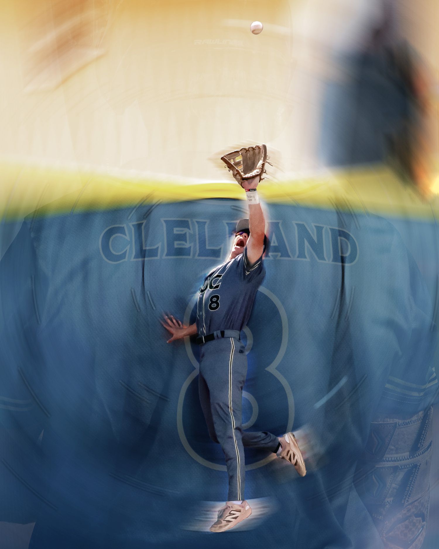Outfielder leaps at Cleveland stadium wall attempting to catch fly ball.