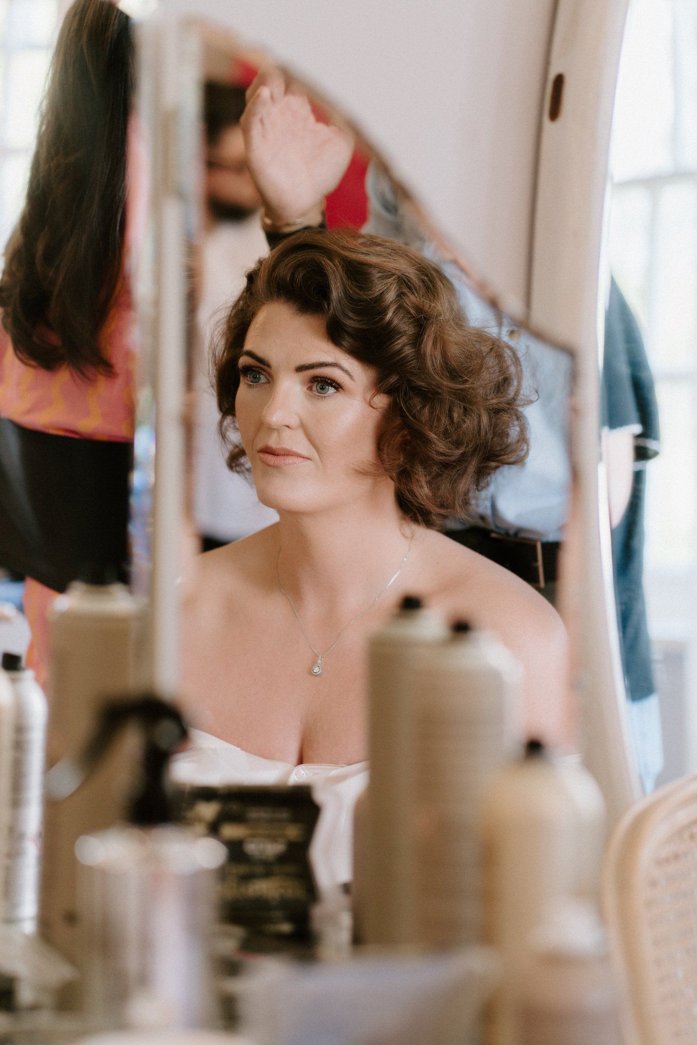 Bride reflected in the mirror during bridal prep in Herefordshire