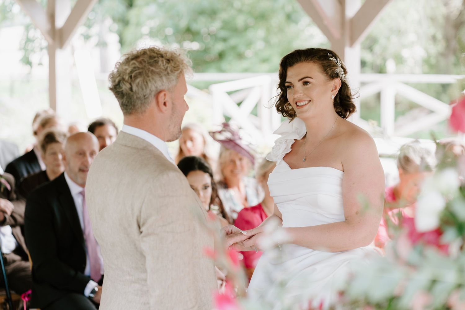 Bride and groom holding hands during their Brinsop Court wedding ceremony