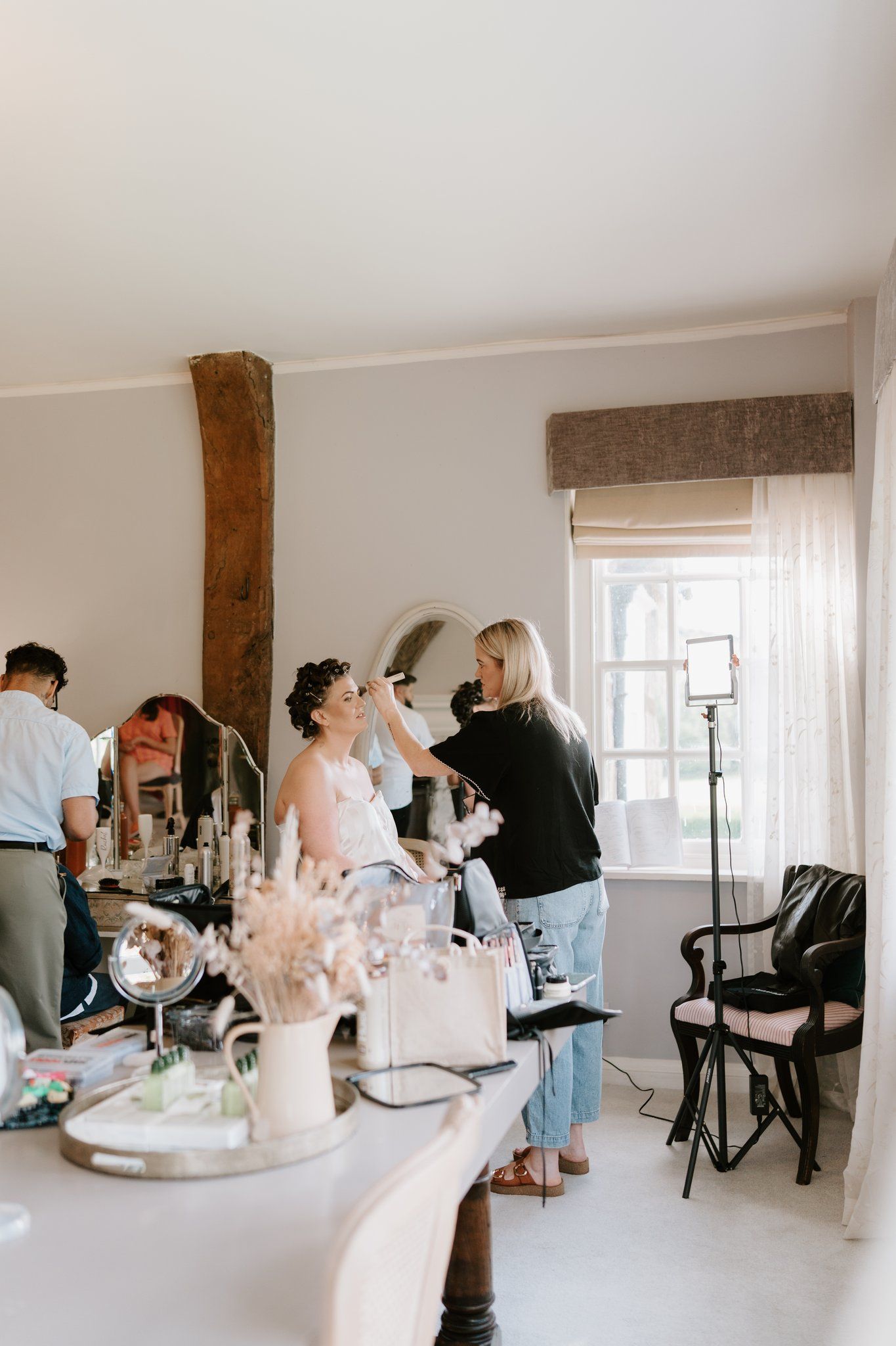 Bride having her hair and make-up done on the morning of her Brinsop Court wedding