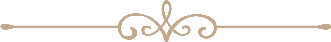 A delicate tan ornamental divider with scrollwork design on a white background.