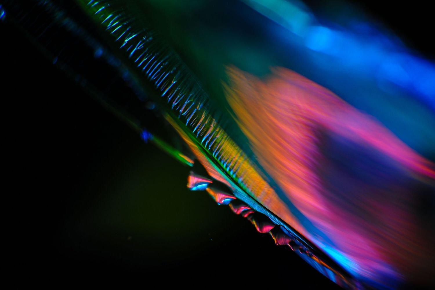 Macro Abstract. Light shining through broken glass,