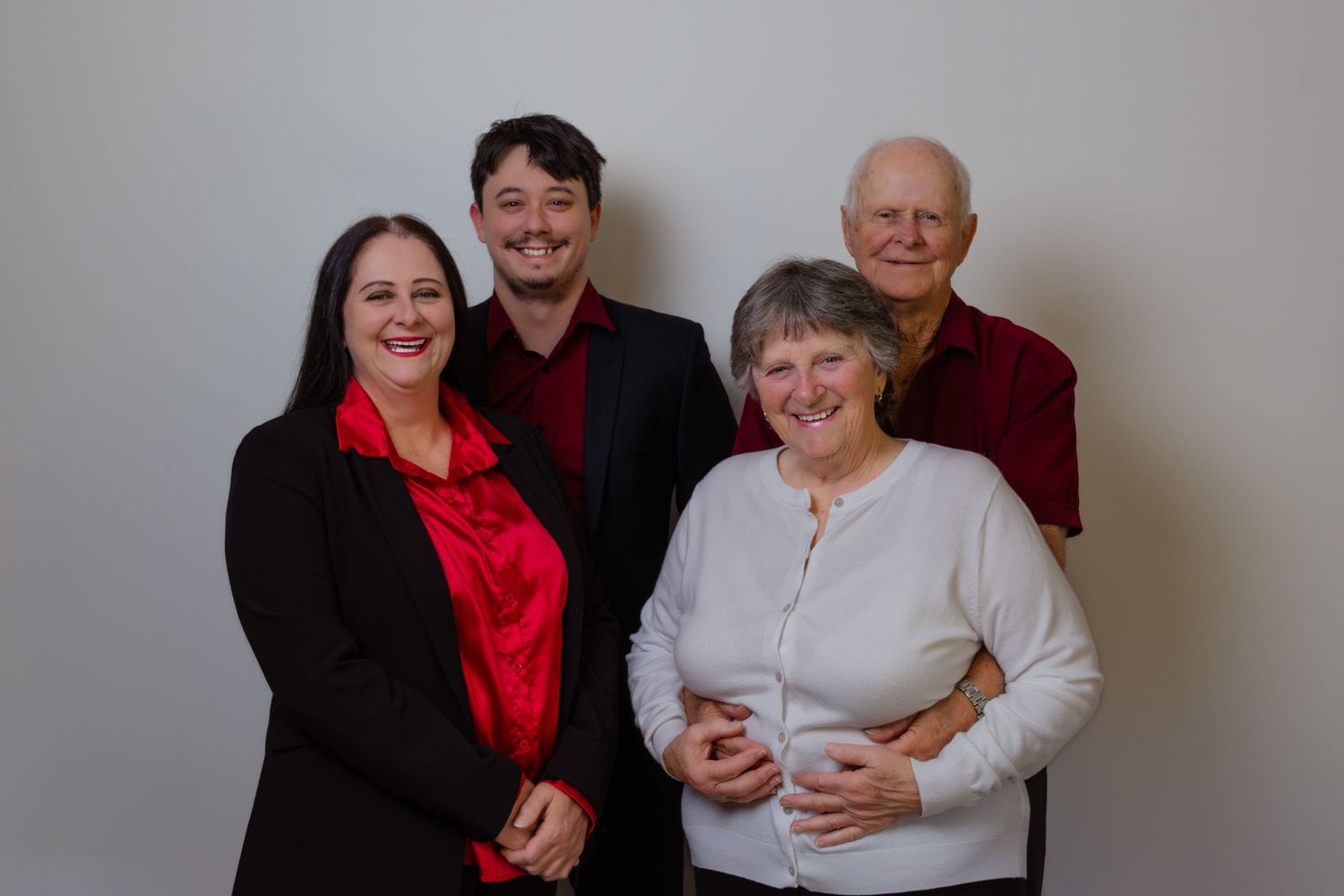 Family group portrait of four people on a studio backdrop, Bathurst