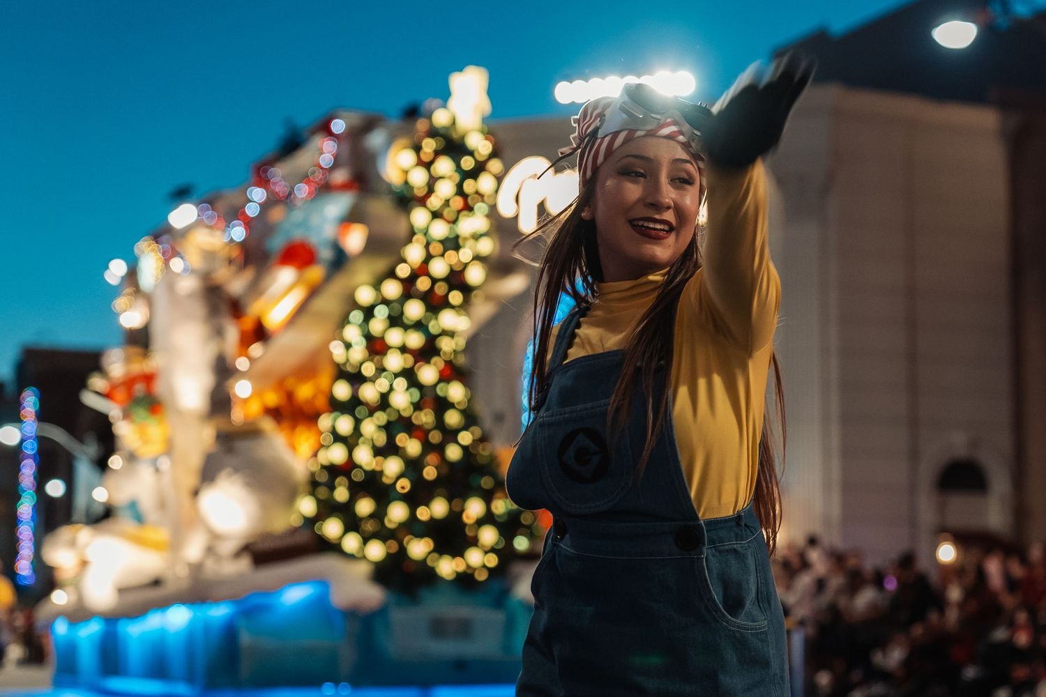 Disney inspired storytelling photography featuring colorful dancer during parade with magical atmosphere. Photographed by Aperture Haus