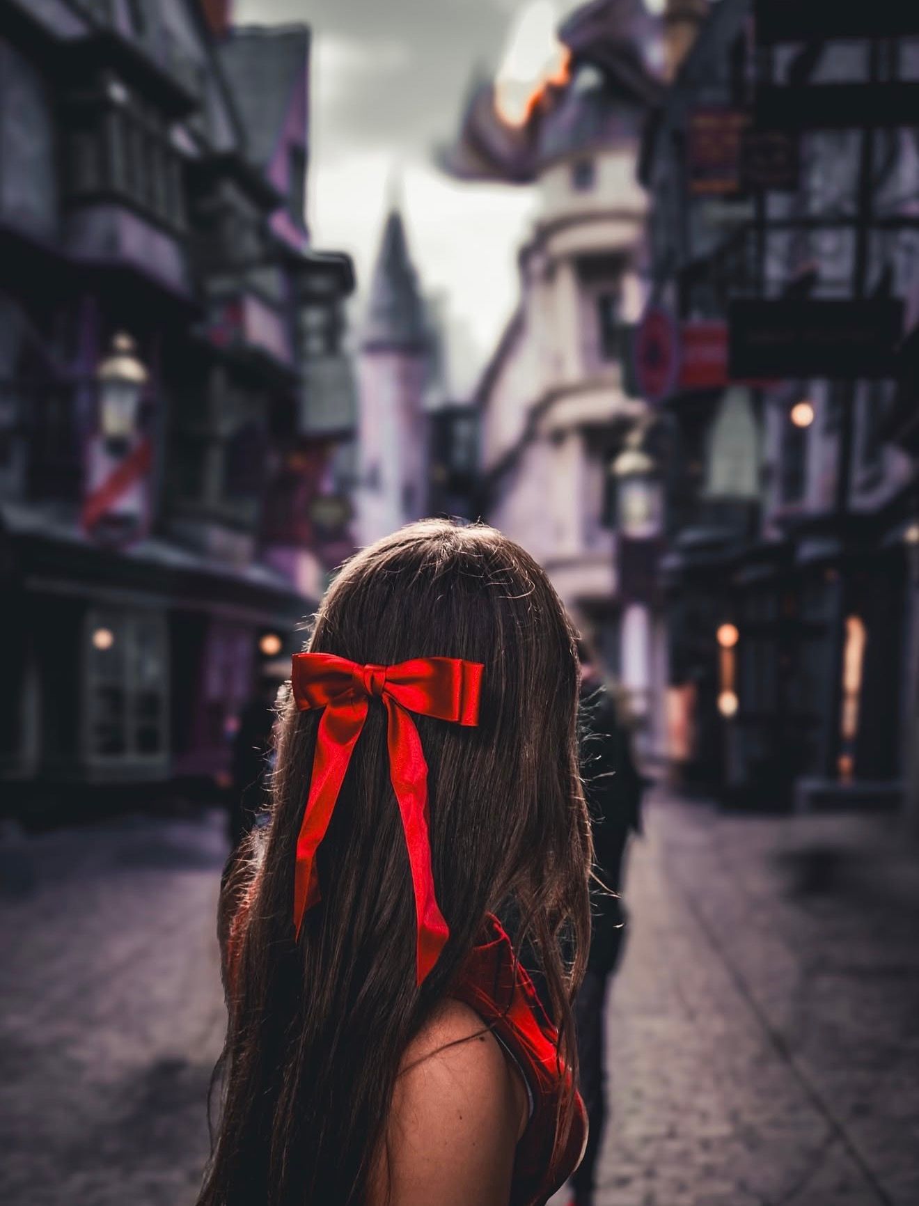 Cinematic travel portrait inspired by Harry Potter at Universal Studios Orlando. Photographed by Katie Ortiz of Aperture Haus Photography