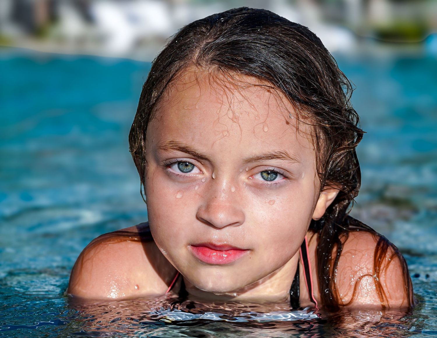 Moody underwater portrait capturing emotion and movement in natural water light along the Florida coast