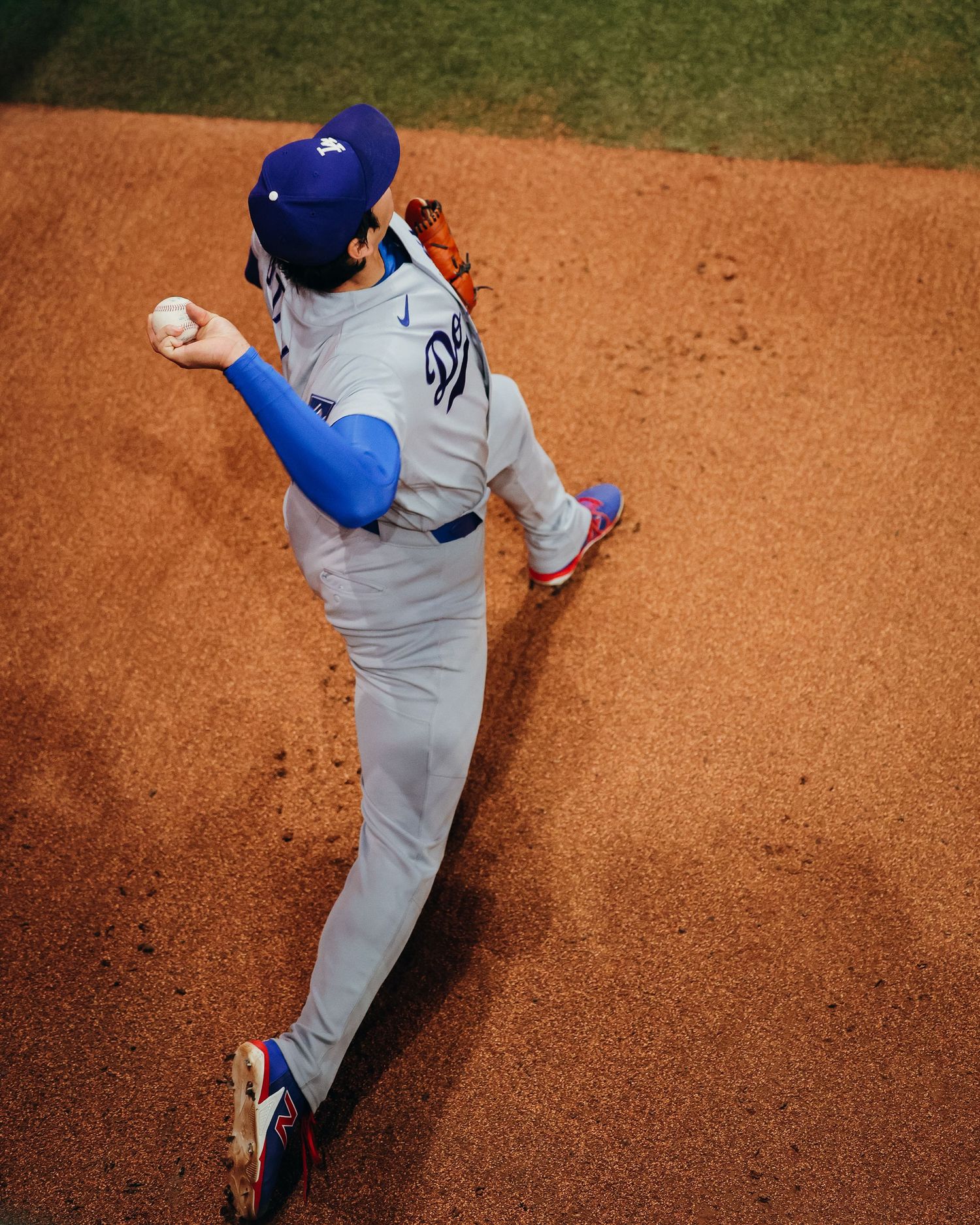 Los Angeles Dodgers pitcher winds up for delivery seen from overhead angle on the mound.