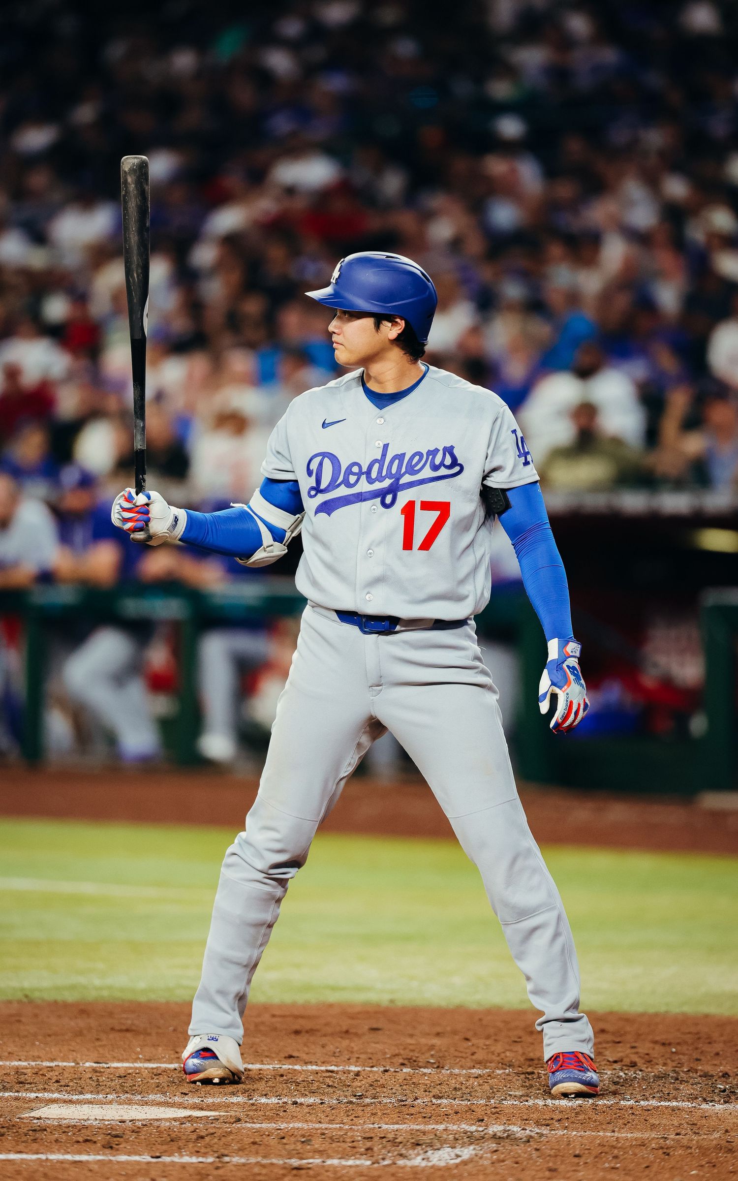 Shohei Ohtani #17 stands ready in batter's box for LA Dodgers in away gray uniform.