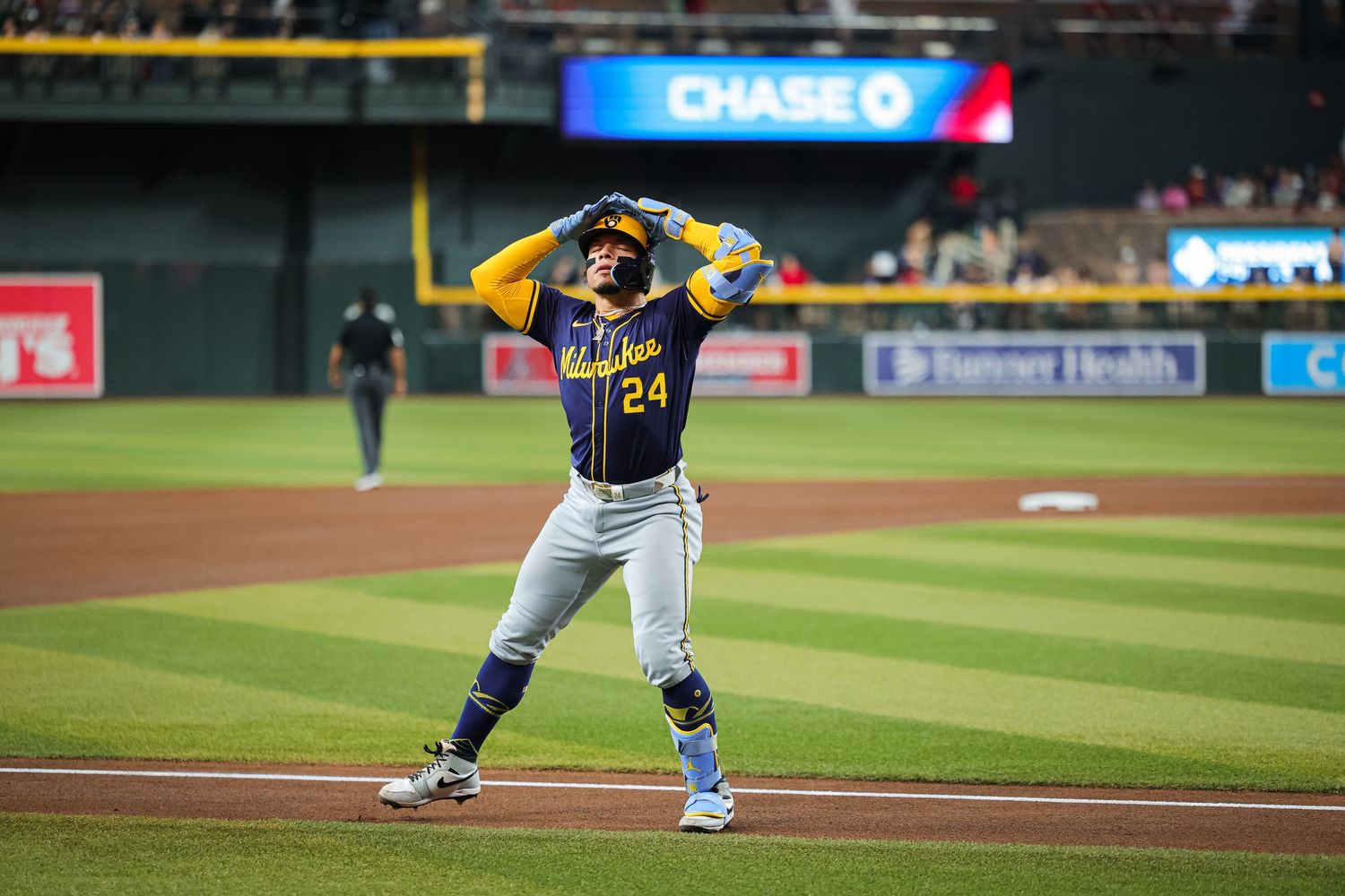 Milwaukee Brewers player number 24 reacting at second base during MLB game at Chase Field.