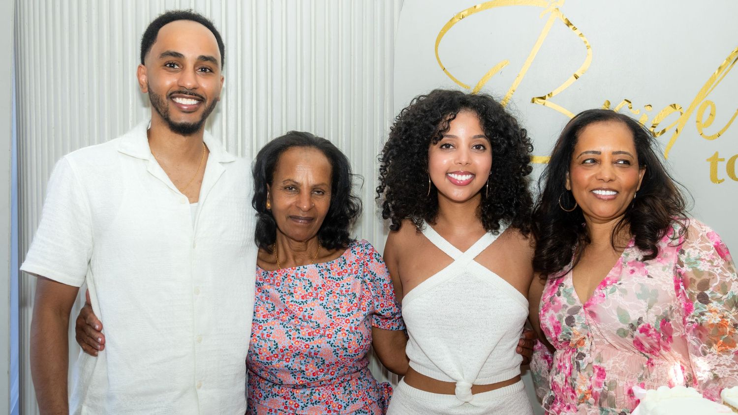 Man and three women posing together at a family celebration