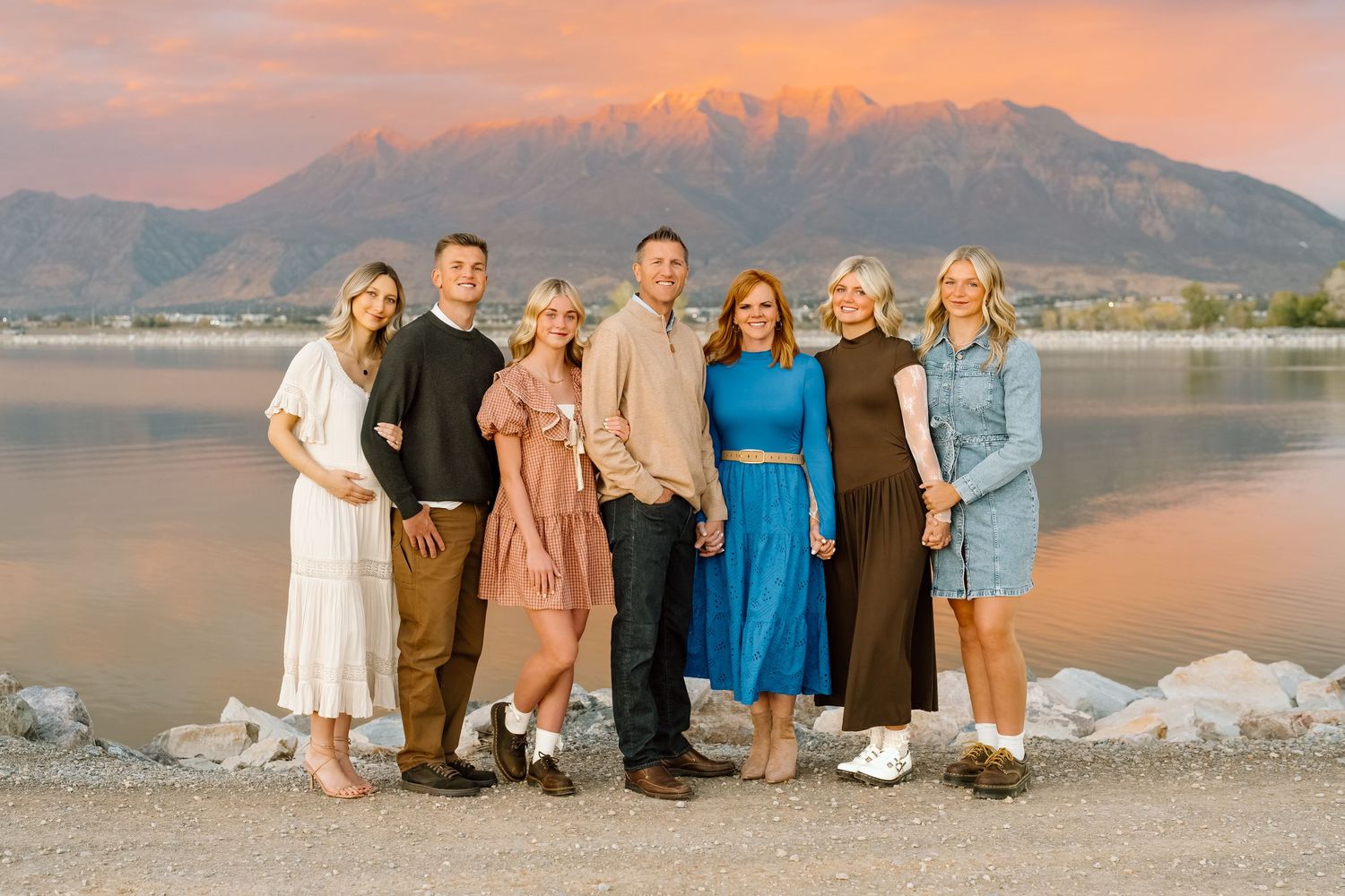 Utah family photo at Utah Lake with Mount Timpanogos in the background and a pink sunset