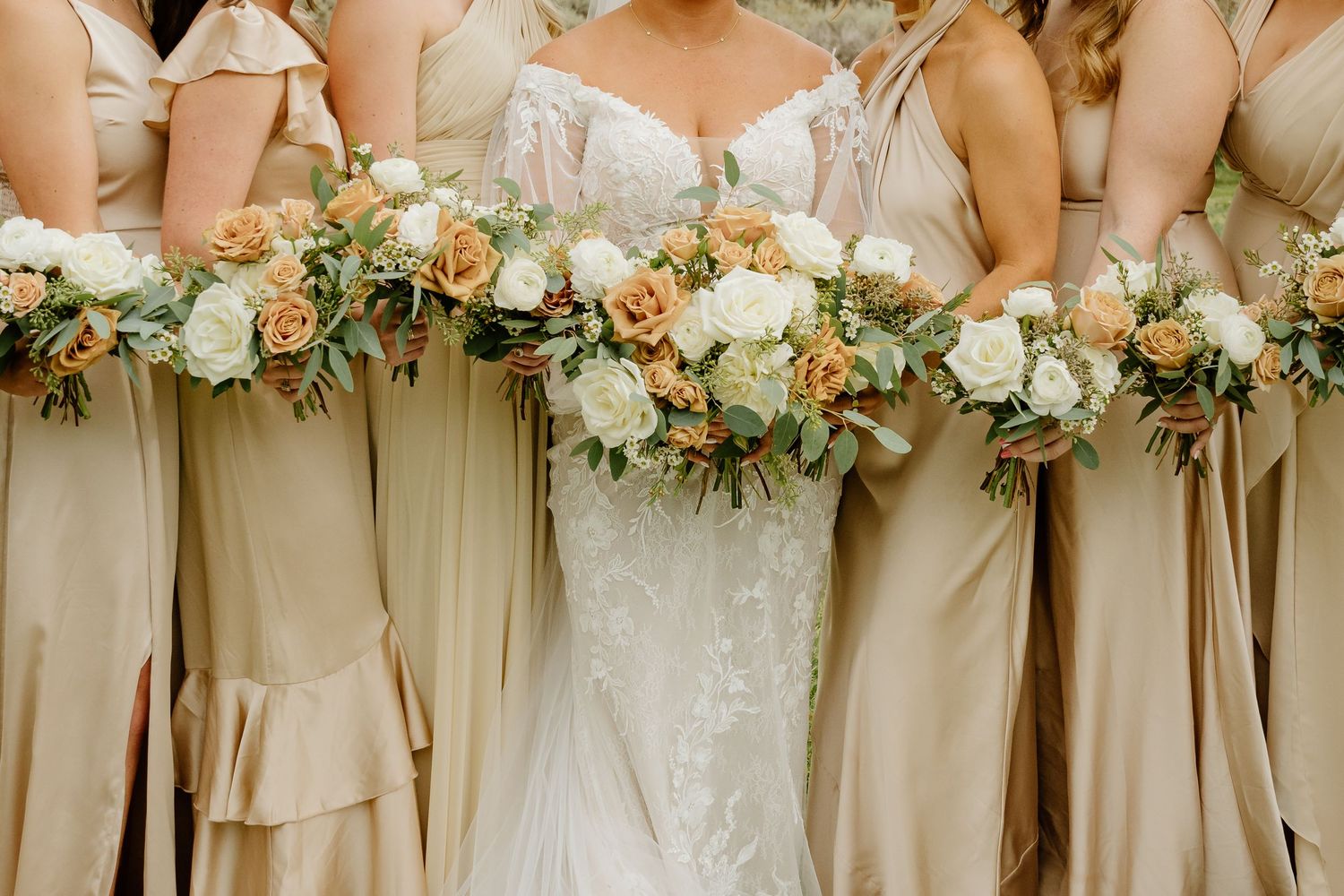 a closeup of the bride and bridesmaids flowers