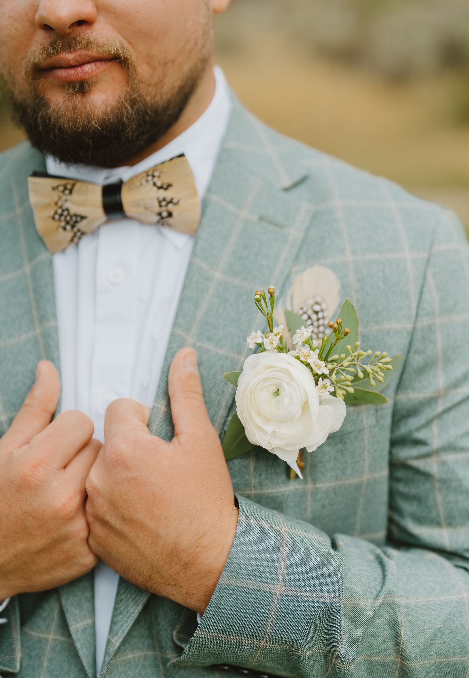 Closeup of the groom and his boutonniere