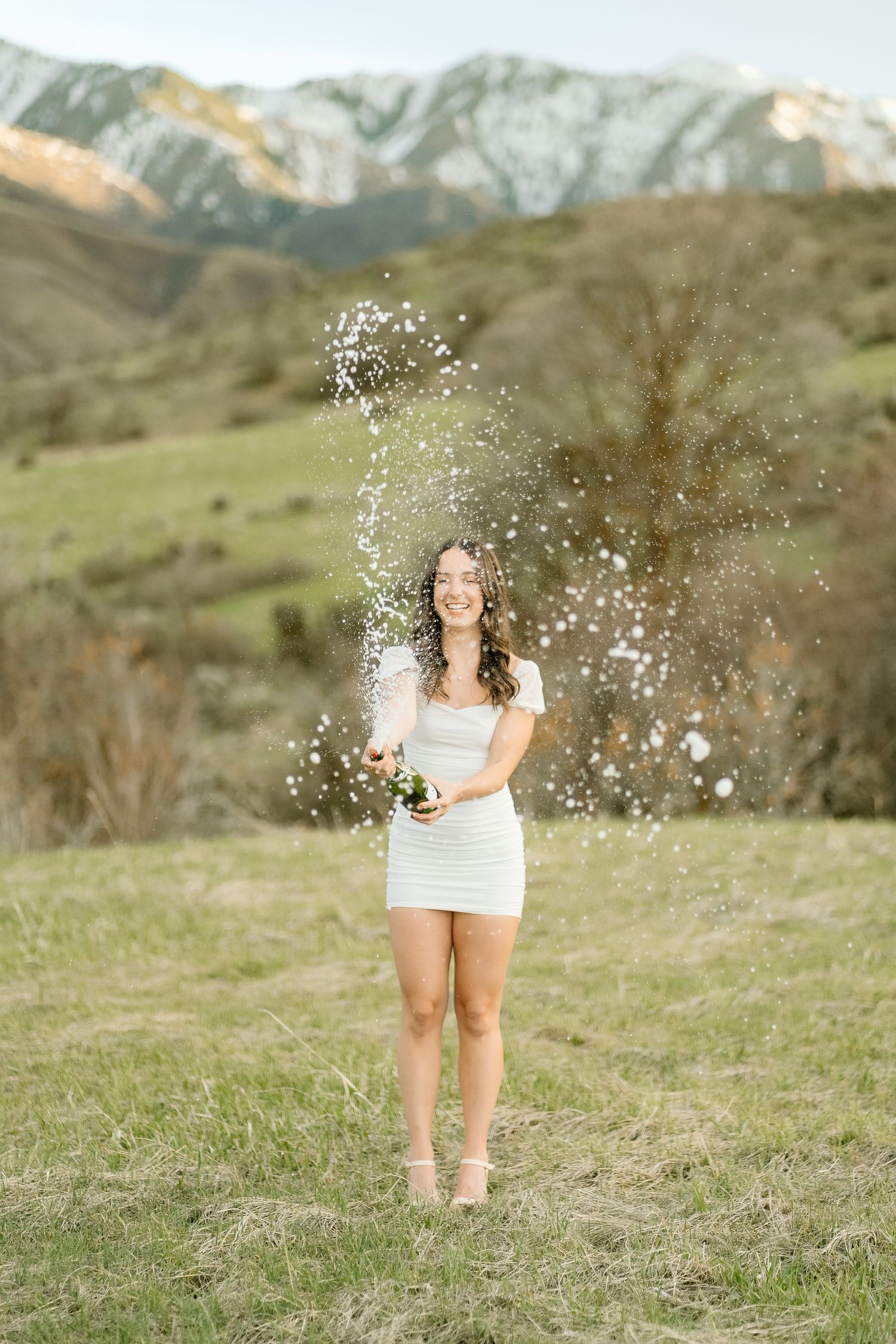 U of U graduate popping champagne: College senior photos