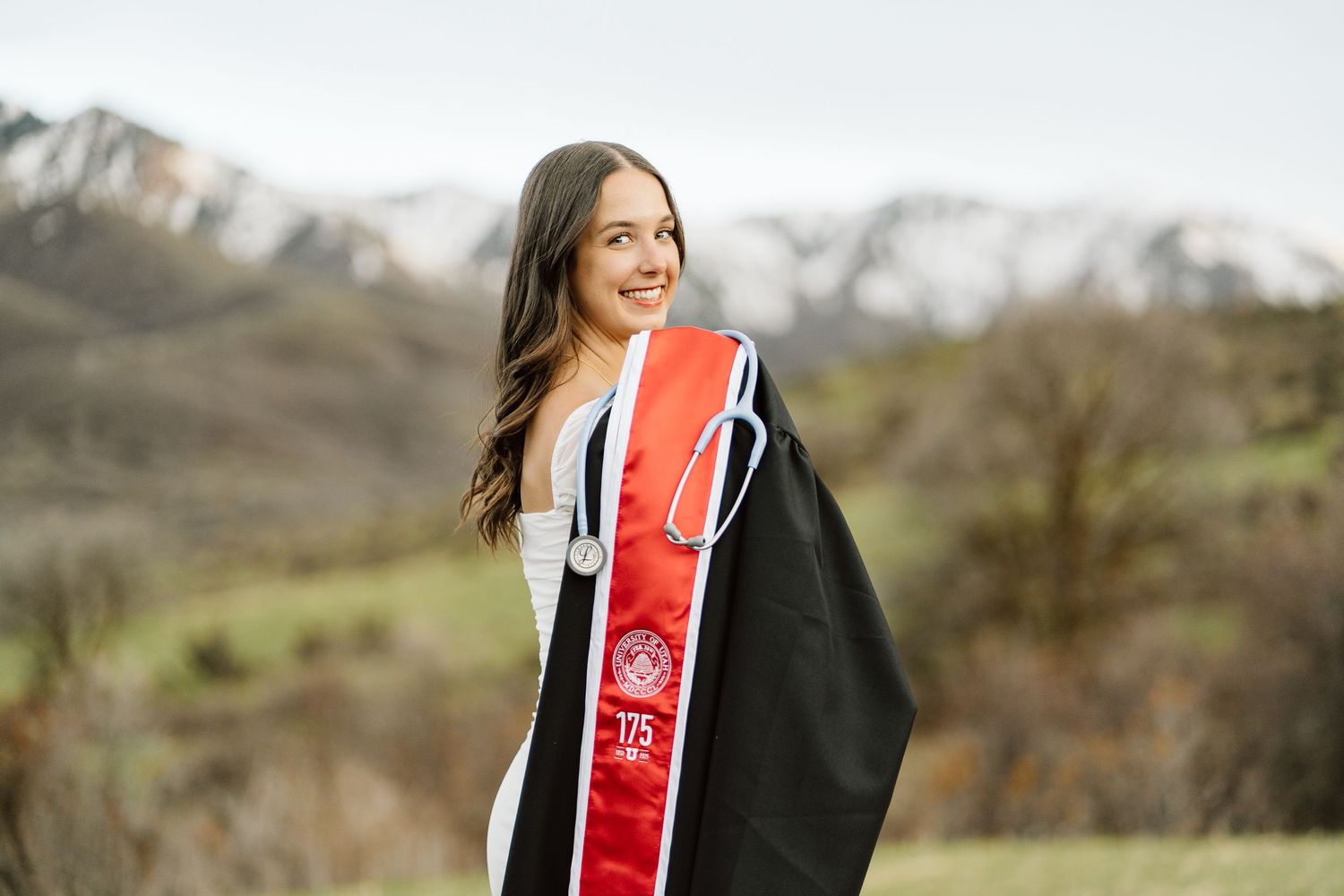 University of Utah Nursing School graduate in her senior photos in the mountains