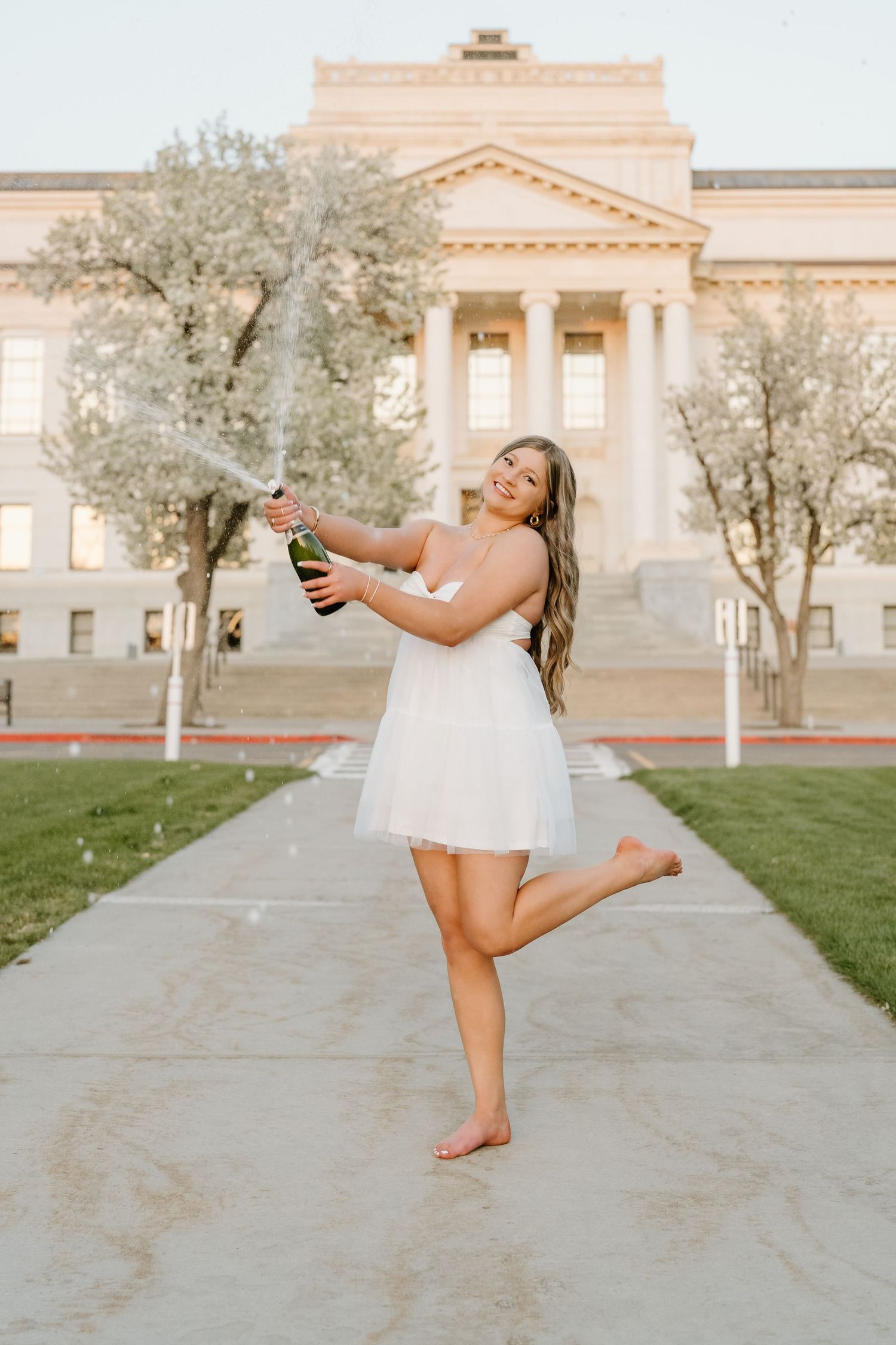 A University of Utah graduate popping champagne