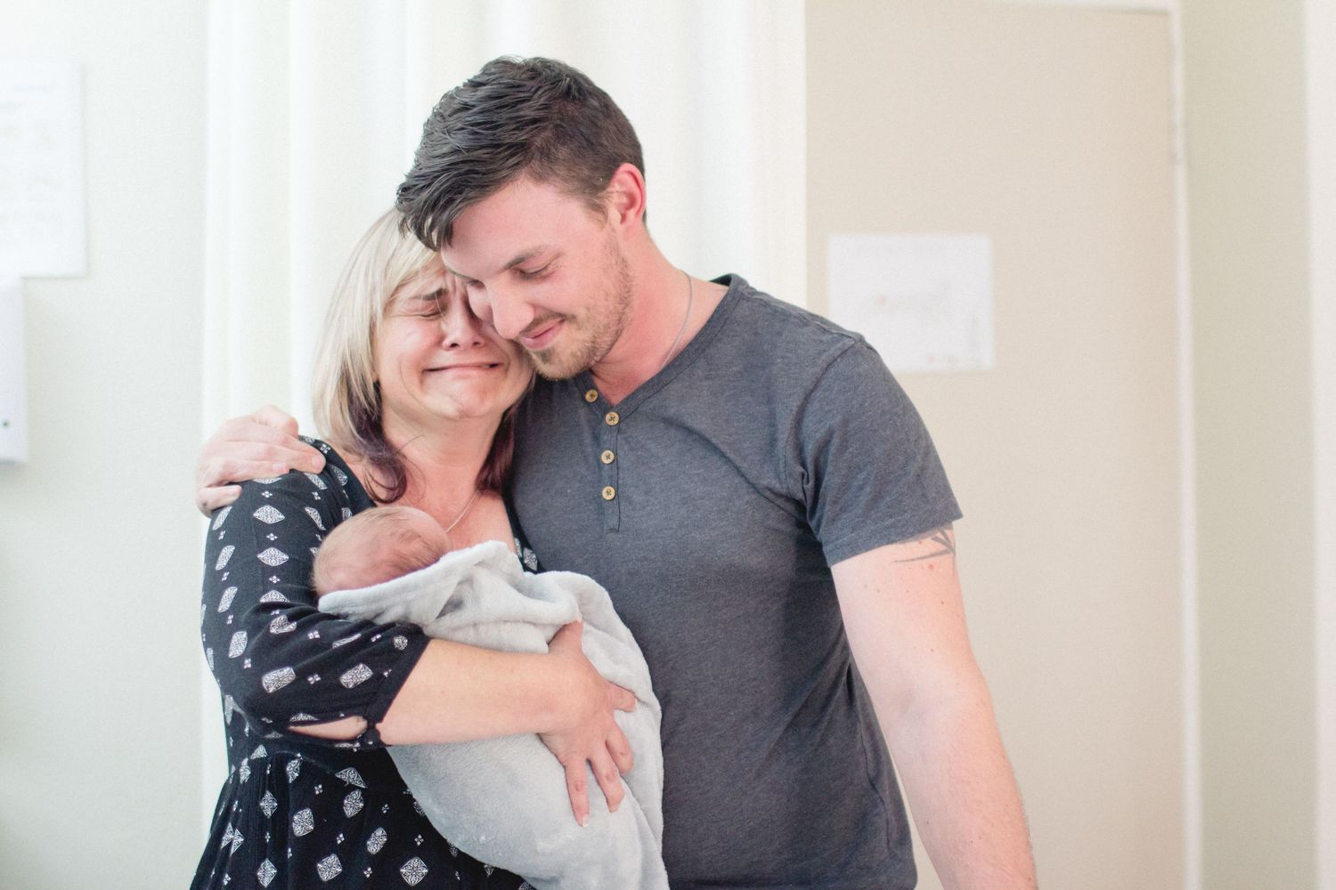 Emotions from a first time grandma holding her first Grandson! Fresh Newborn 1 hour old . Birth Photography