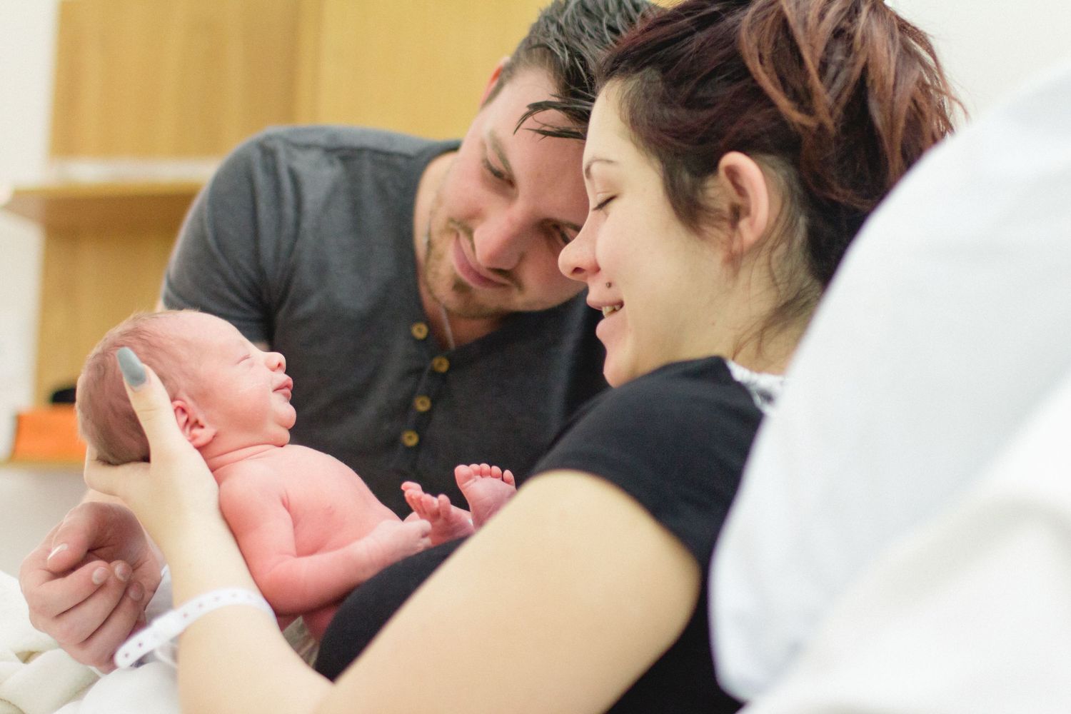 Parents in awe. Fresh Newborn . Birth Photography