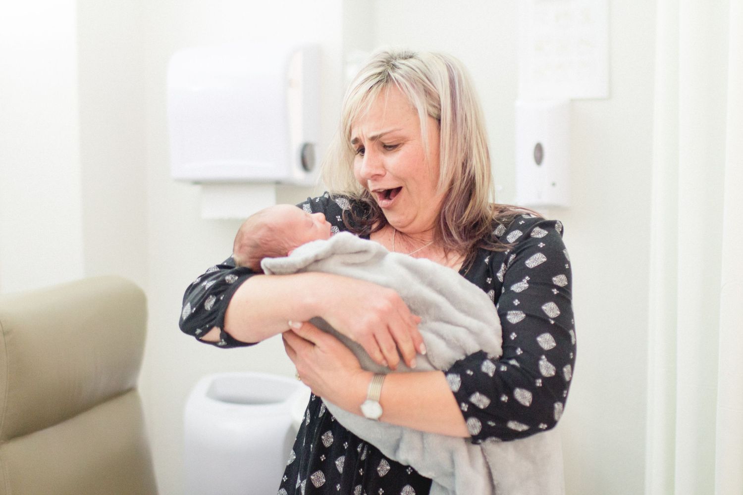 Emotions from a first time grandma holding her first Grandson! Fresh Newborn 1 hour old . Birth Photography