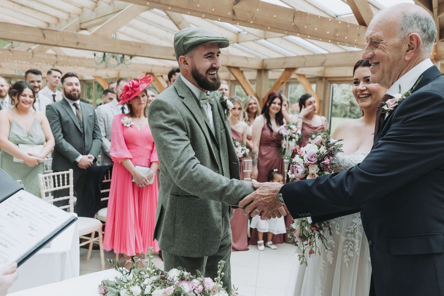 Wedding ceremony moments captured in a series of candid photographs showing interactions between guests and attendees.