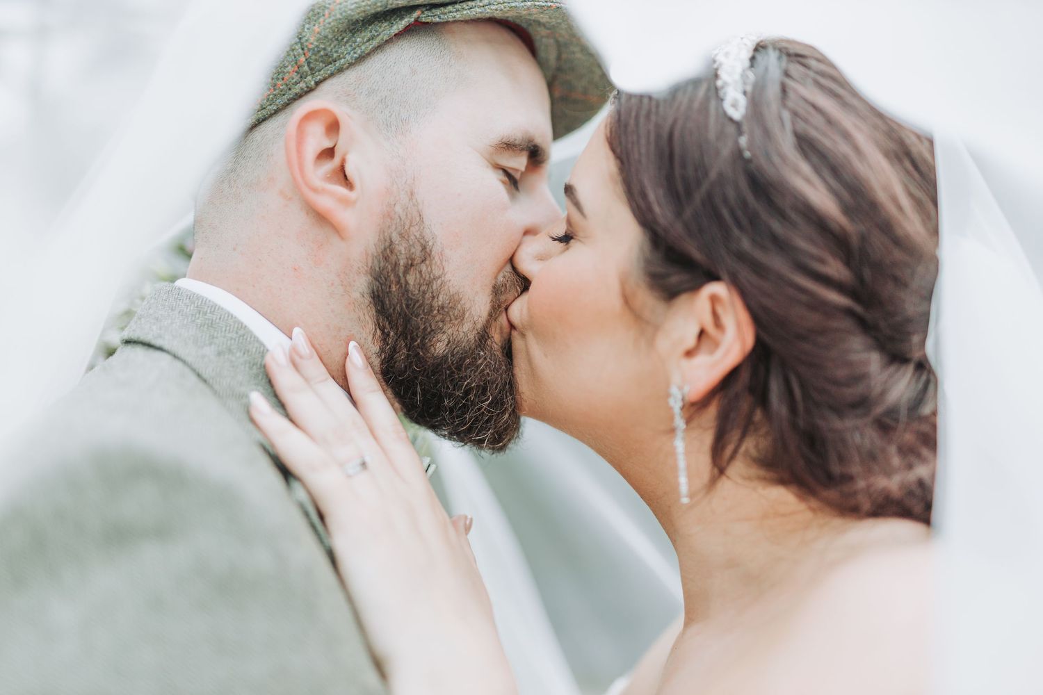 A romantic series of intimate moments captured between a couple in soft, muted tones.