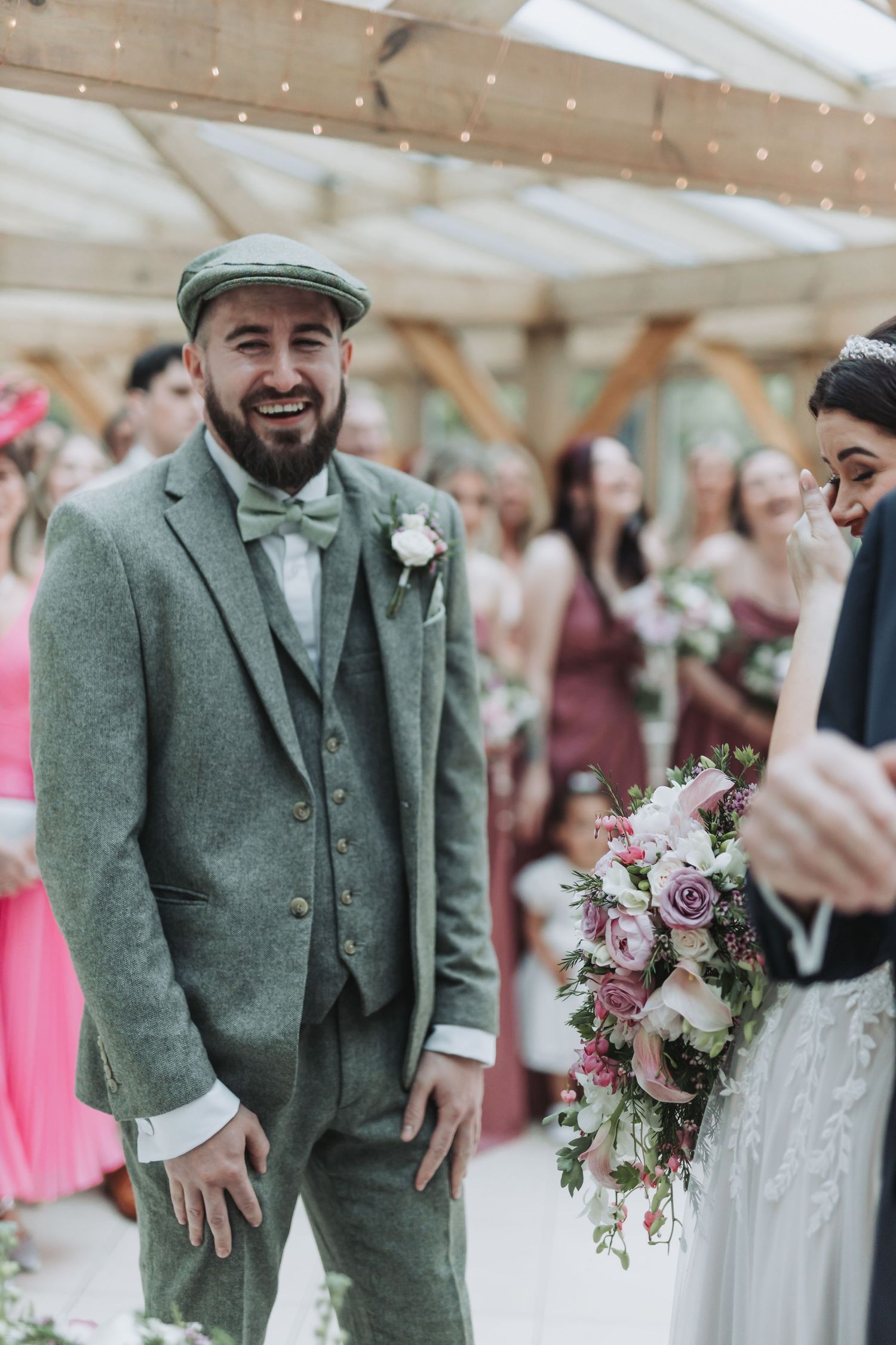 Wedding party photos showing groomsmen in green tweed suits and bridesmaids in pink dresses at an indoor reception.