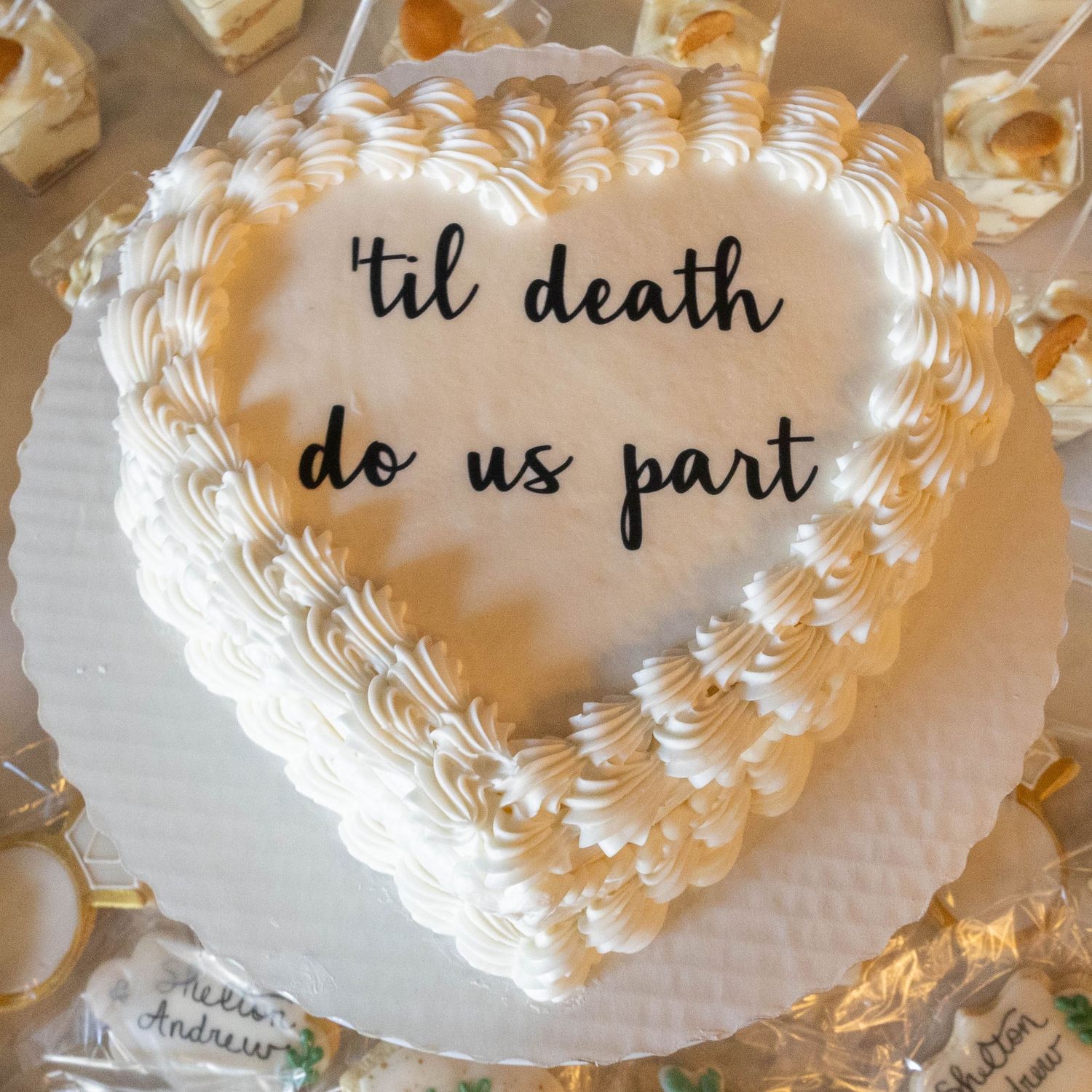 White paper plates with decorative lace-like borders arranged in an overlapping pattern with elegant cursive text.