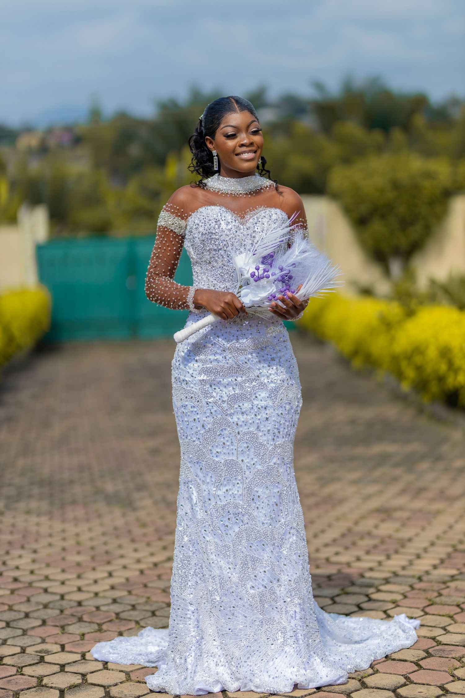 A sparkling white sequined wedding gown with off-shoulder design is showcased in multiple angles on a brick pathway.