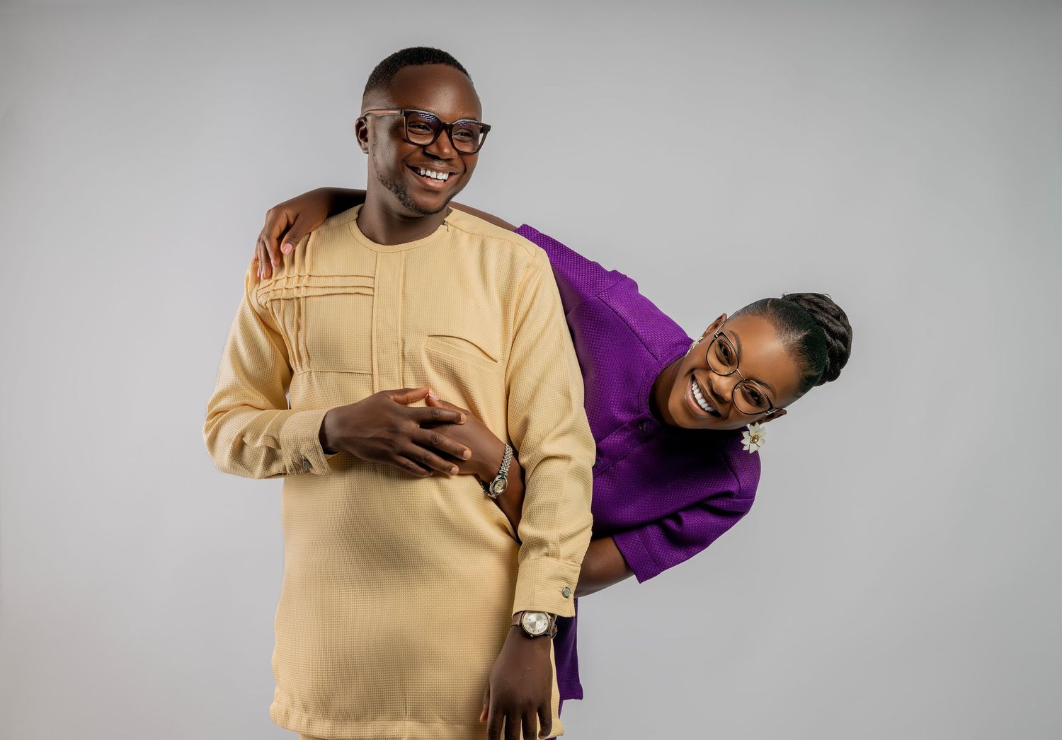 Person in beige sweater expressing different emotions and poses against light background.
