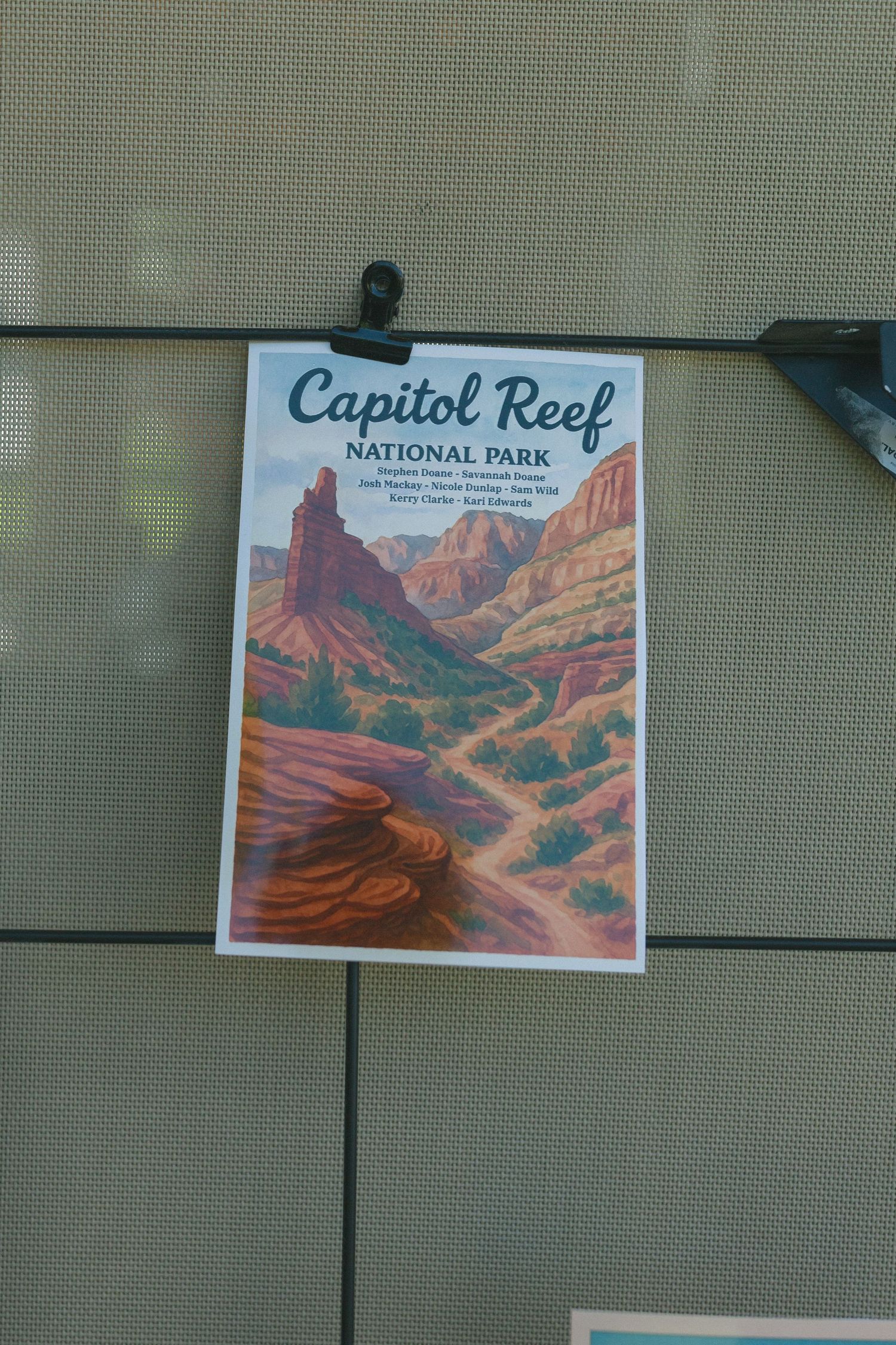 Capitol Reef National Park vintage-style poster showing red rock canyon landscape.