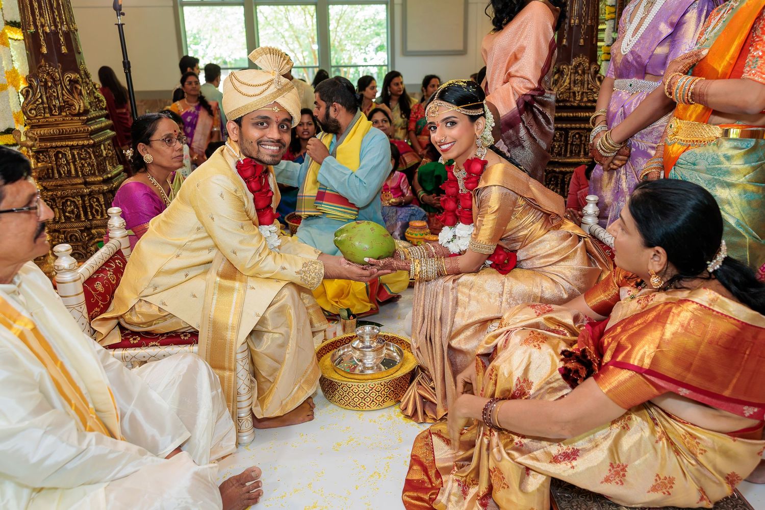 Traditional Hindu wedding rituals being performed with decorative items and offerings.
