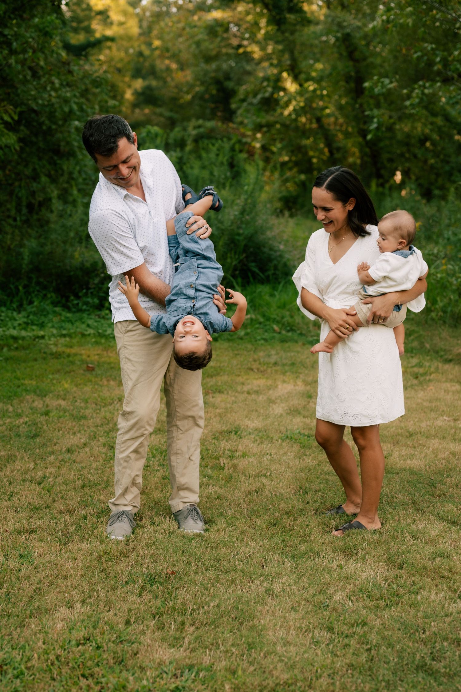A series of candid family photos showing playful moments with a baby in a grassy outdoor setting during golden hour.