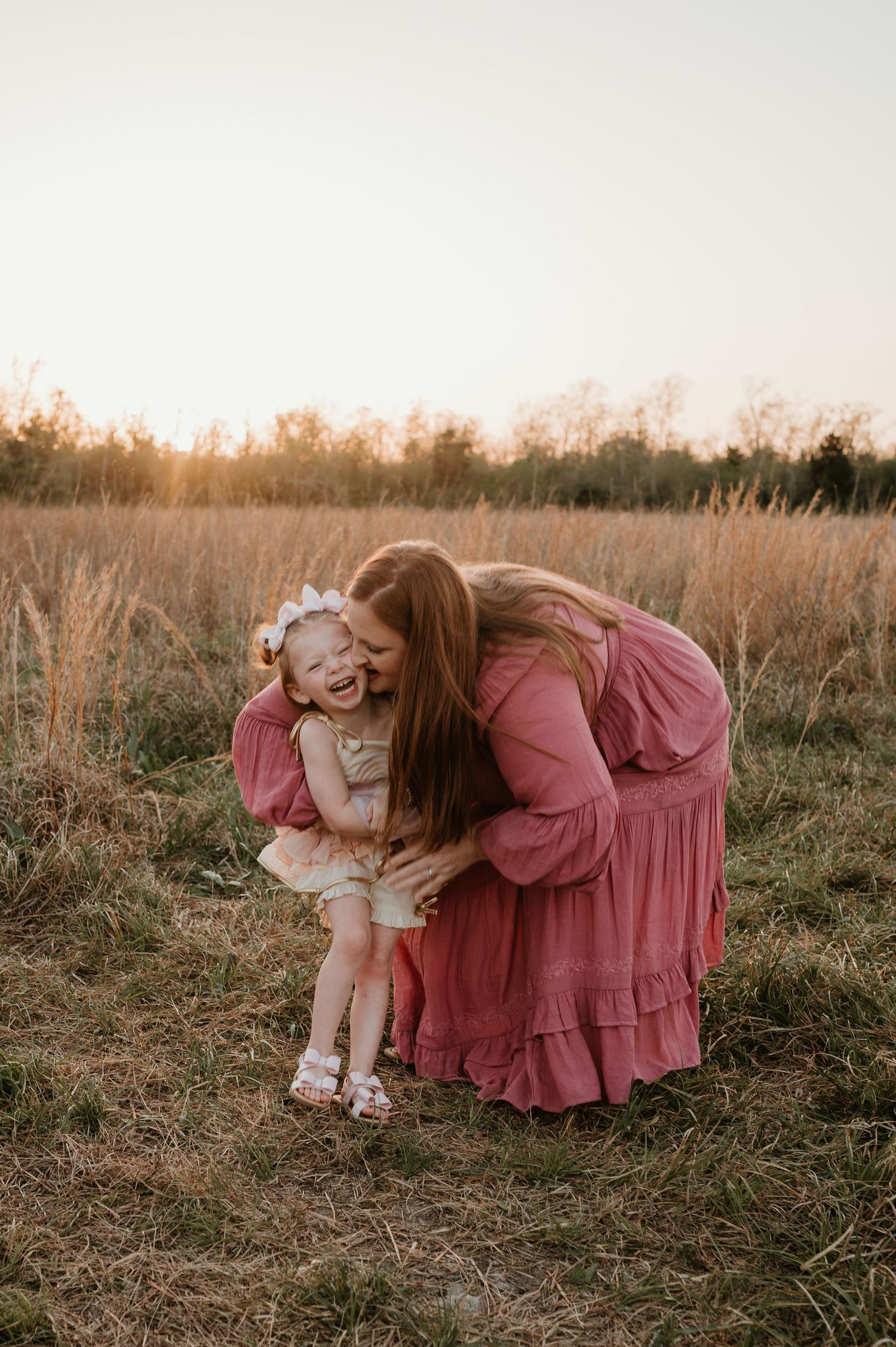 A mother and daughter laughing and loving each other