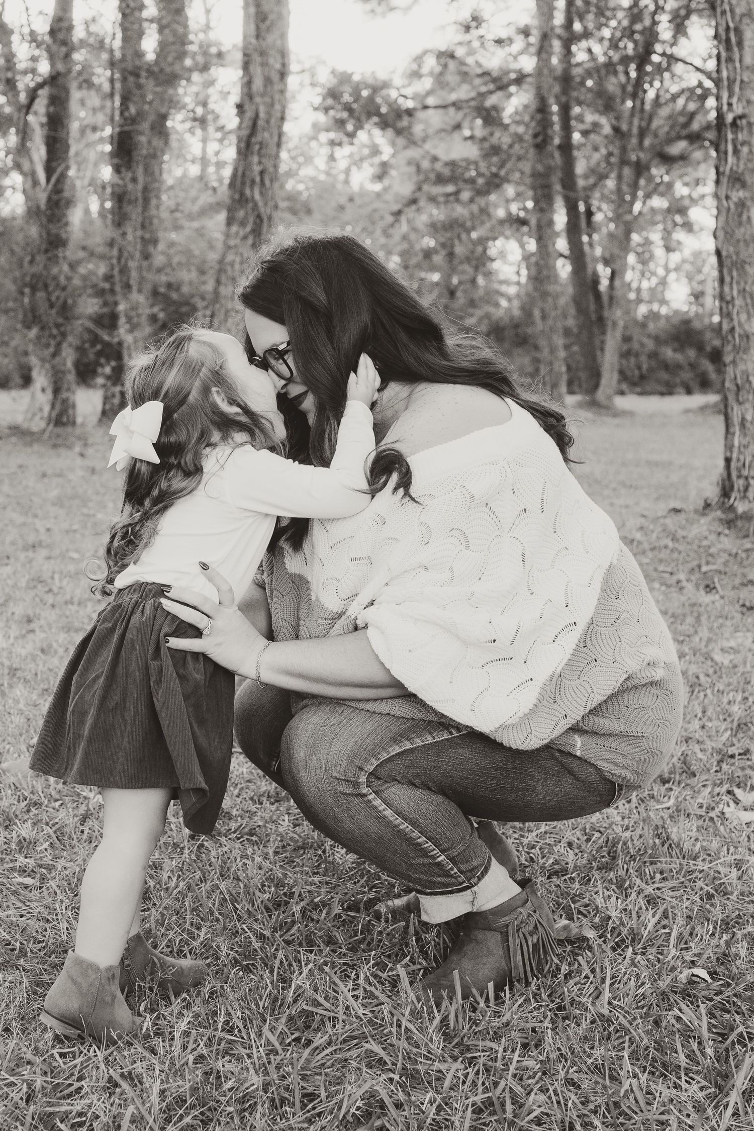 Mother and daughter embrace during a gender reveal and pregnancy announcement session