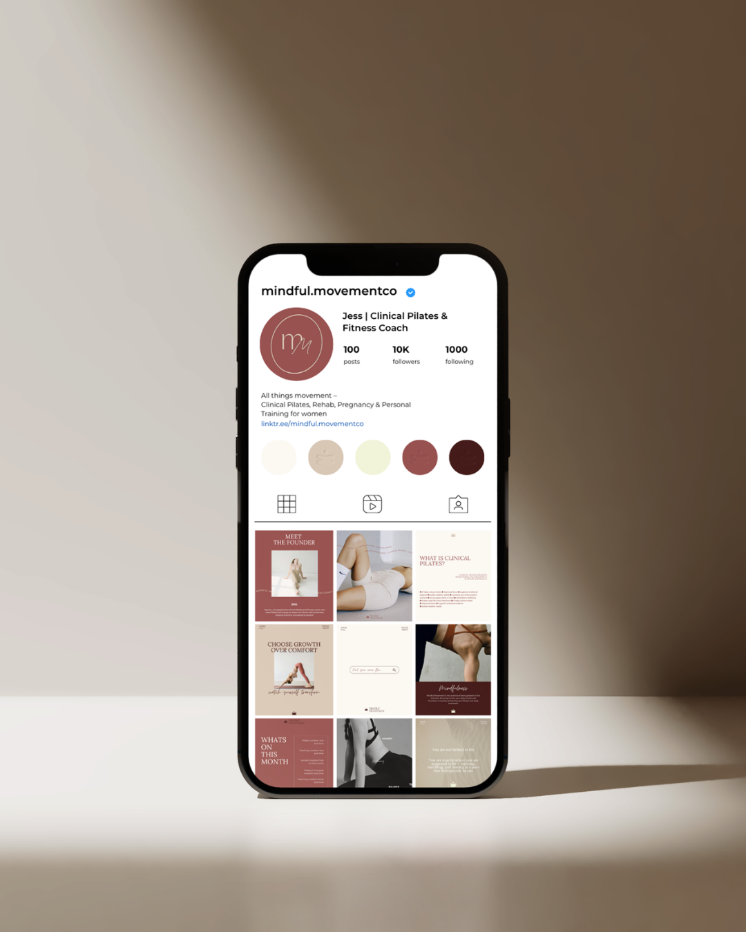iPhone mockup showing Mindful Movement branded Instagram profile grid for a clinical pilates coach.
