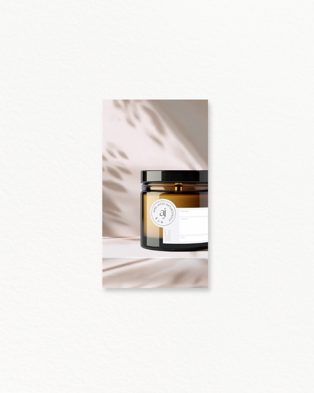 Amber glass supplement jar with circular branded label displayed against soft shadow leaf background.
