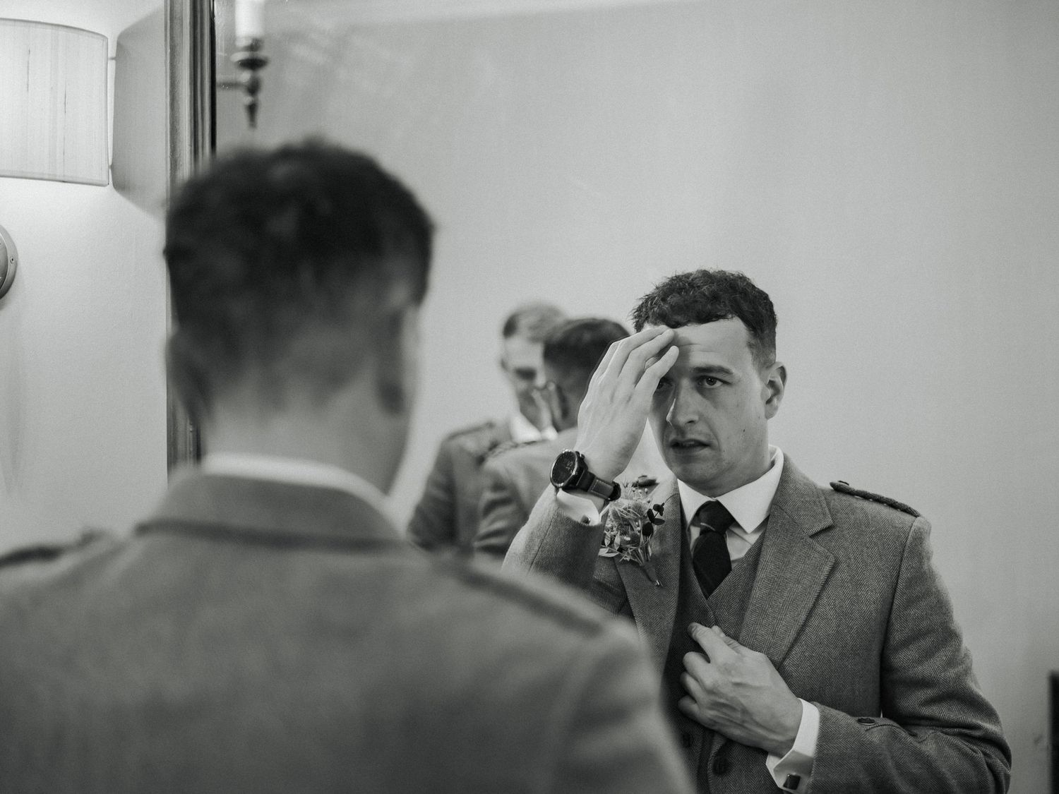 Black and white photo showing press photographers with vintage cameras taking pictures at press event in 1940s style.