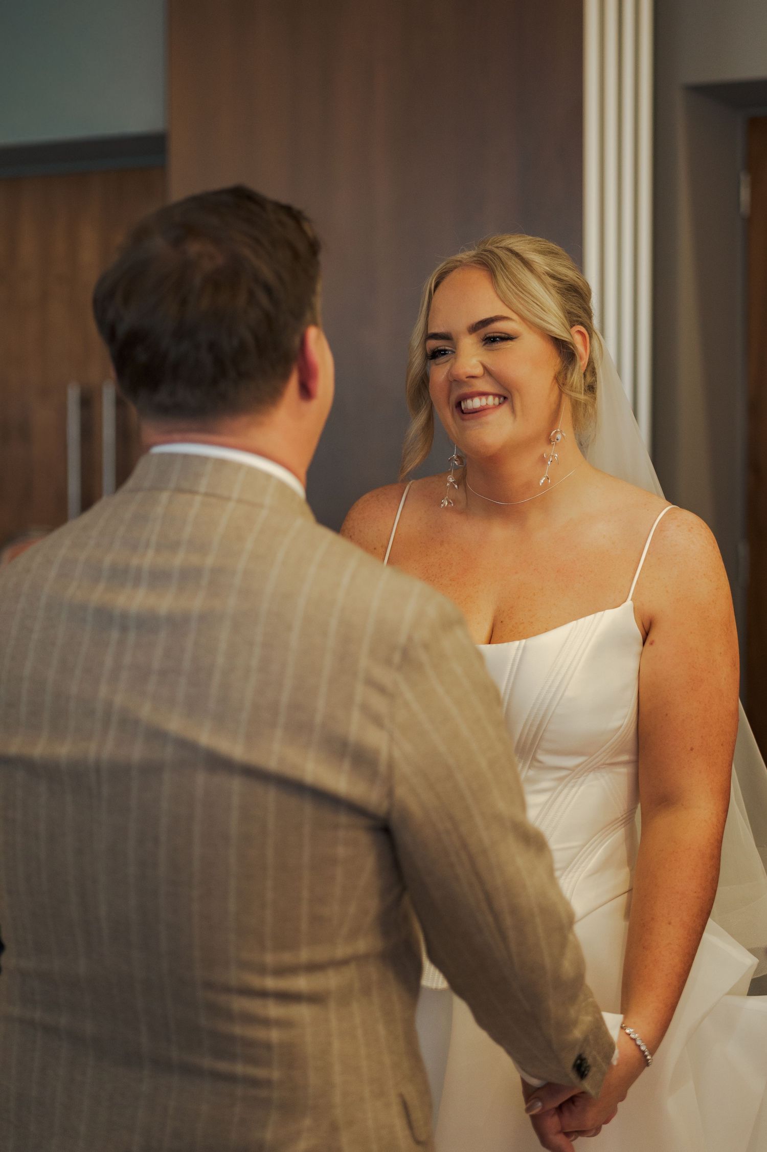 Candid moment between couple during wedding celebration.