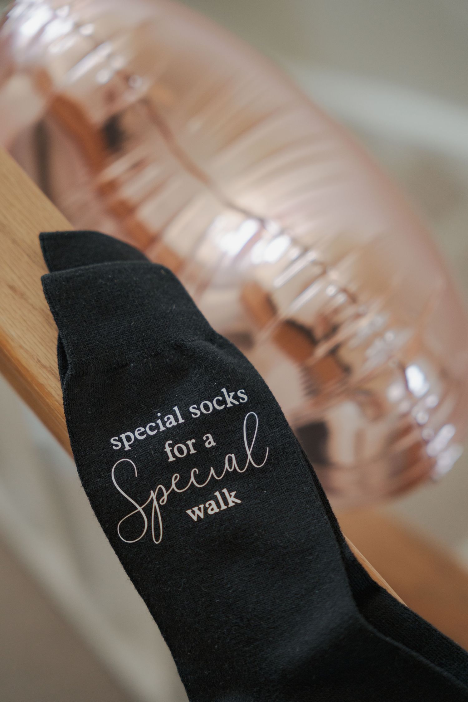 Black socks with embroidered text 'Special socks for a walk' shown in multiple close-up detail shots.