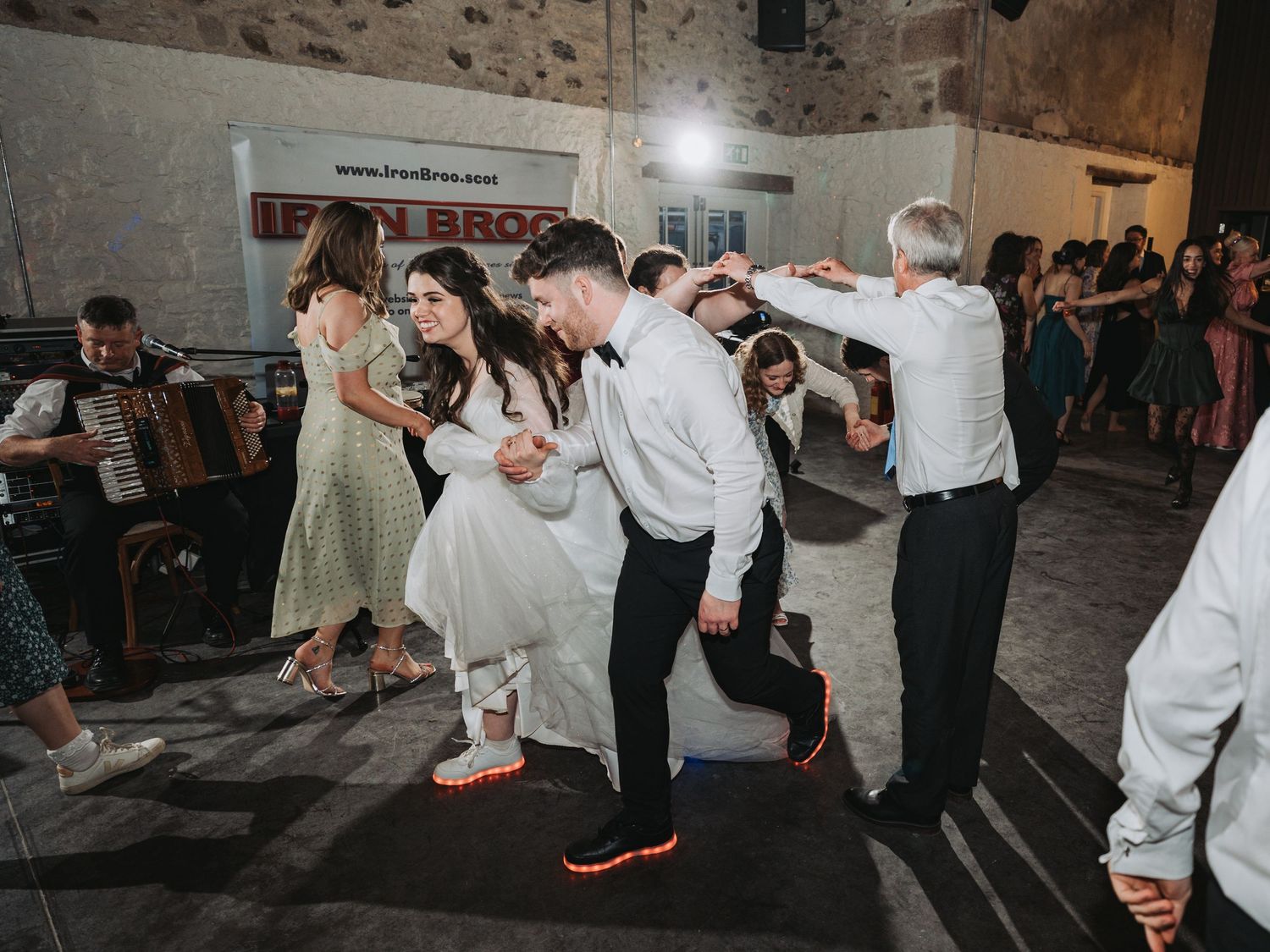Wedding guests show off their dance moves on the reception dance floor in Kinclune House.