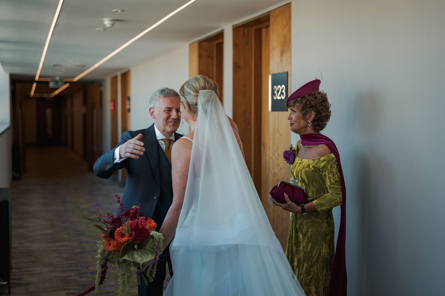 A series of wedding preparation moments showing a flowing white bridal gown and floral bouquet in a hallway setting.