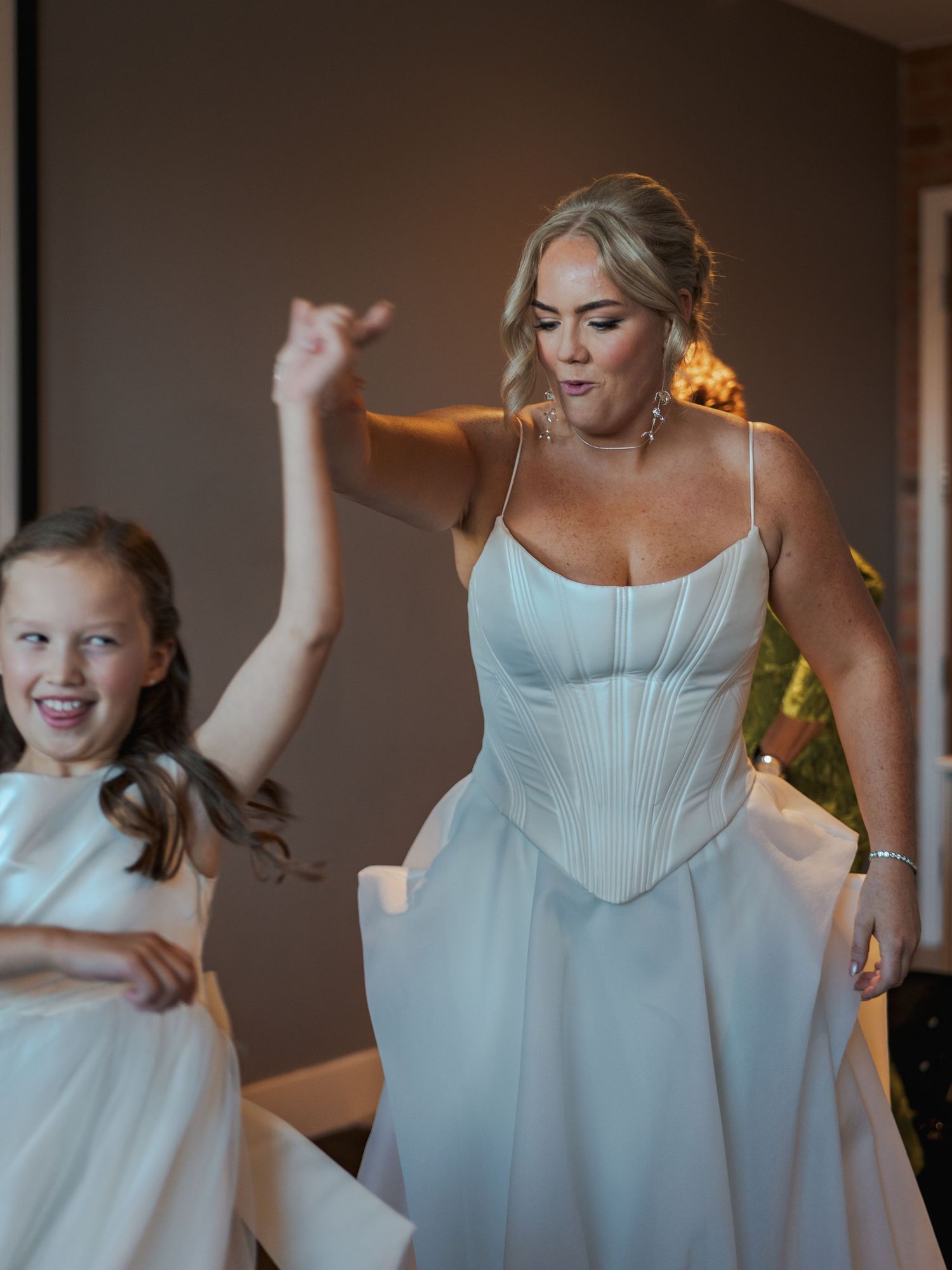 A series of joyful moments captured in light blue dresses during wedding preparations.