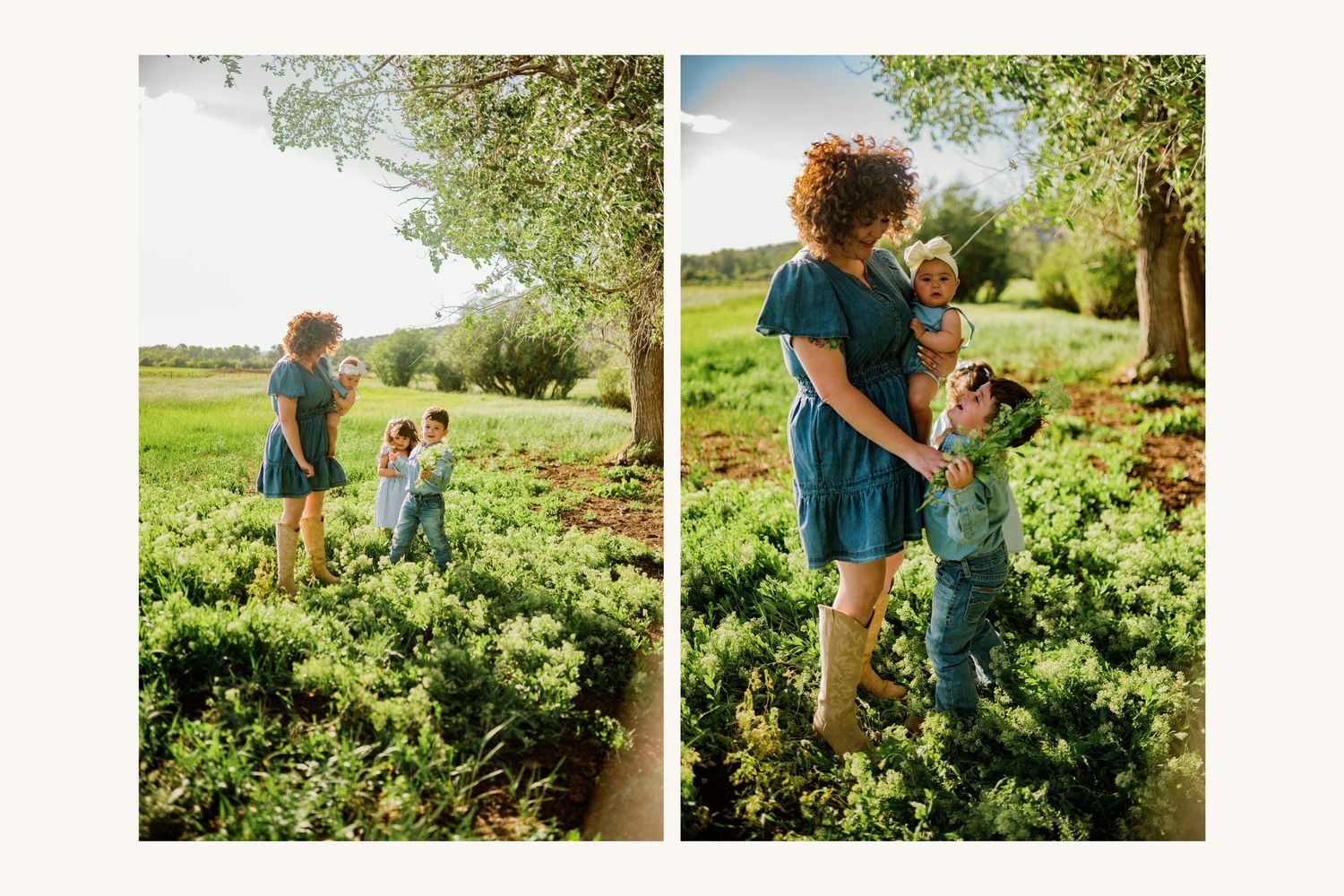 A mother with curly red hair in a teal dress holds her toddler while an older child plays nearby in a lush green garden.
