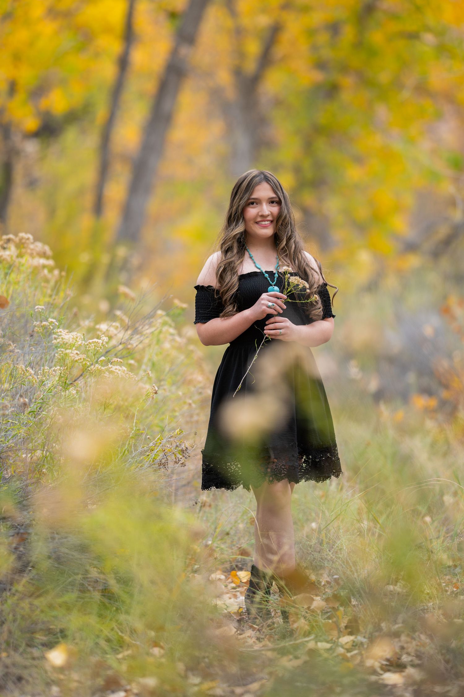 Series of autumn outdoor photos showing a photographer in a black top taking pictures among yellow foliage and wild grass.
