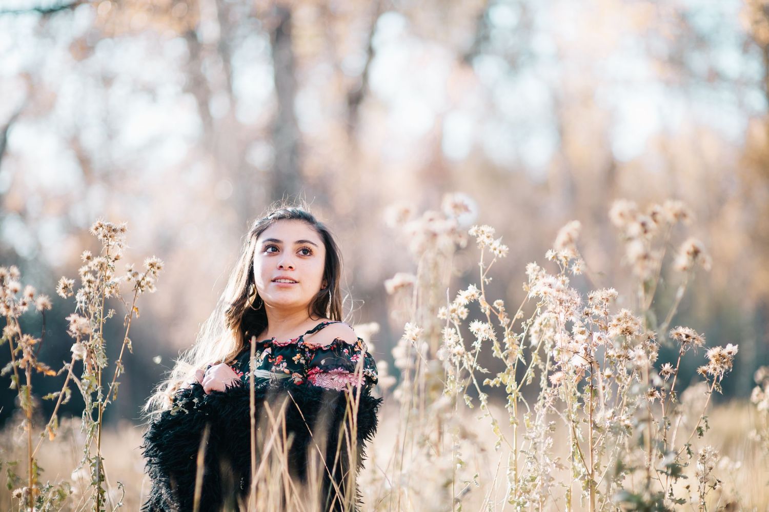 Outdoor senior portrait of a high school girl smiling in soft natural light — captured in northern New Mexico by Quiet Light by The Amoras.