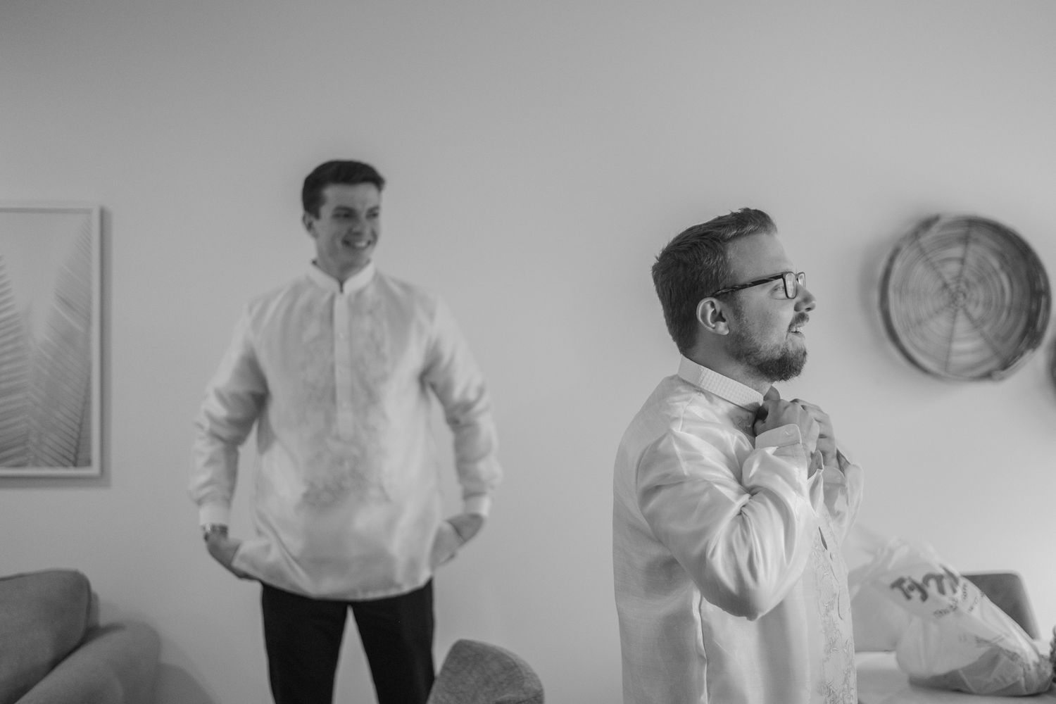 A black and white photo sequence showing someone performing various poses and movements in a room.