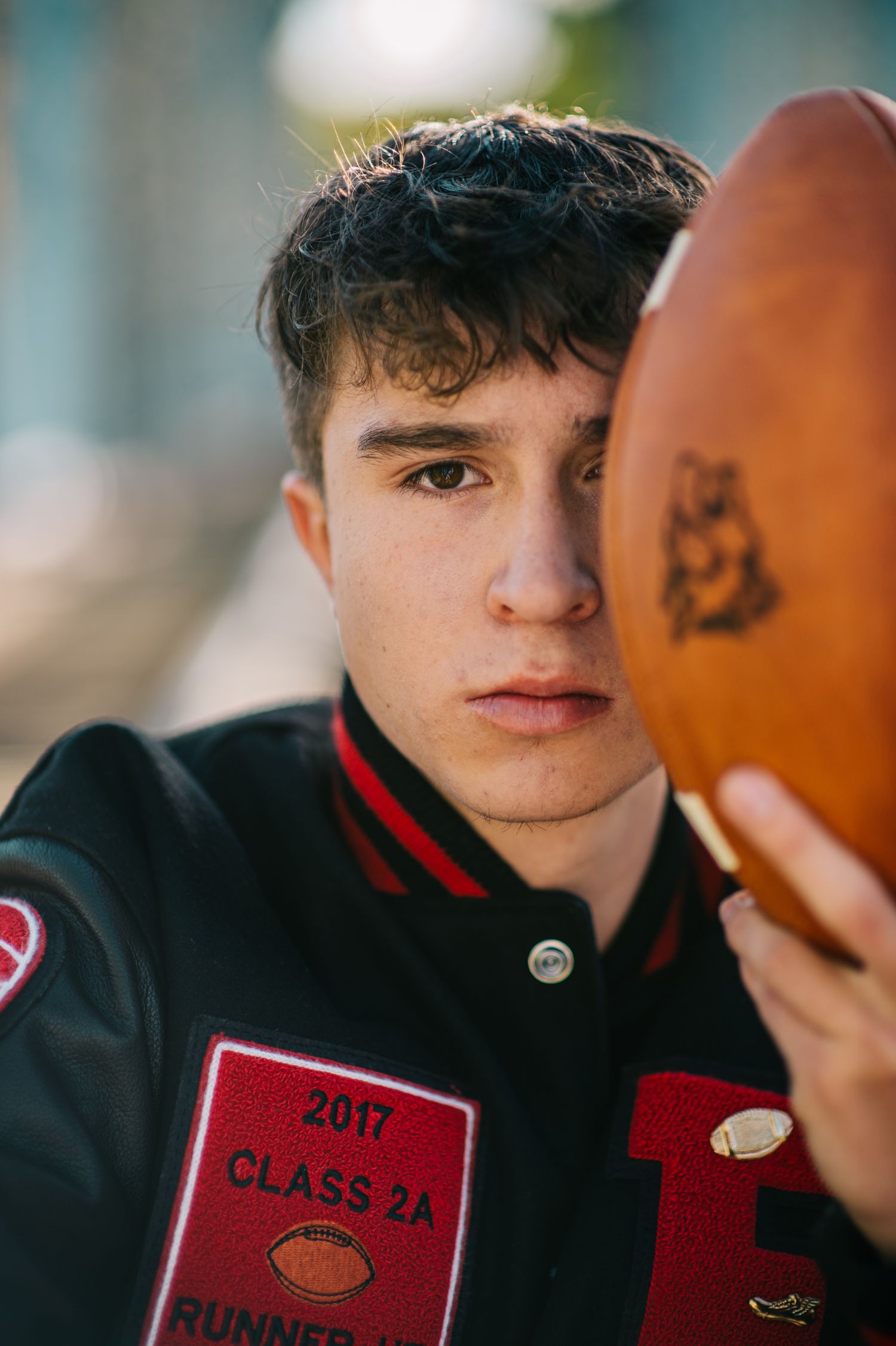 Close-up detail of a 2017 class memorabilia showing red and black colors.
