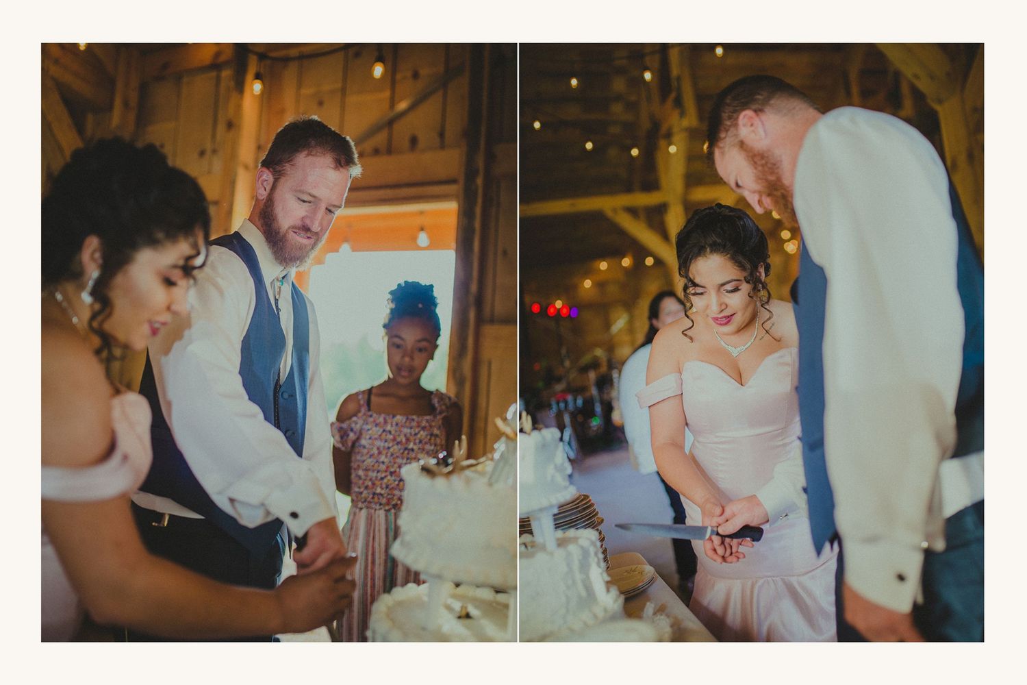 Bride and groom cutting wedding cake together in a rustic barn venue with guests watching nearby.