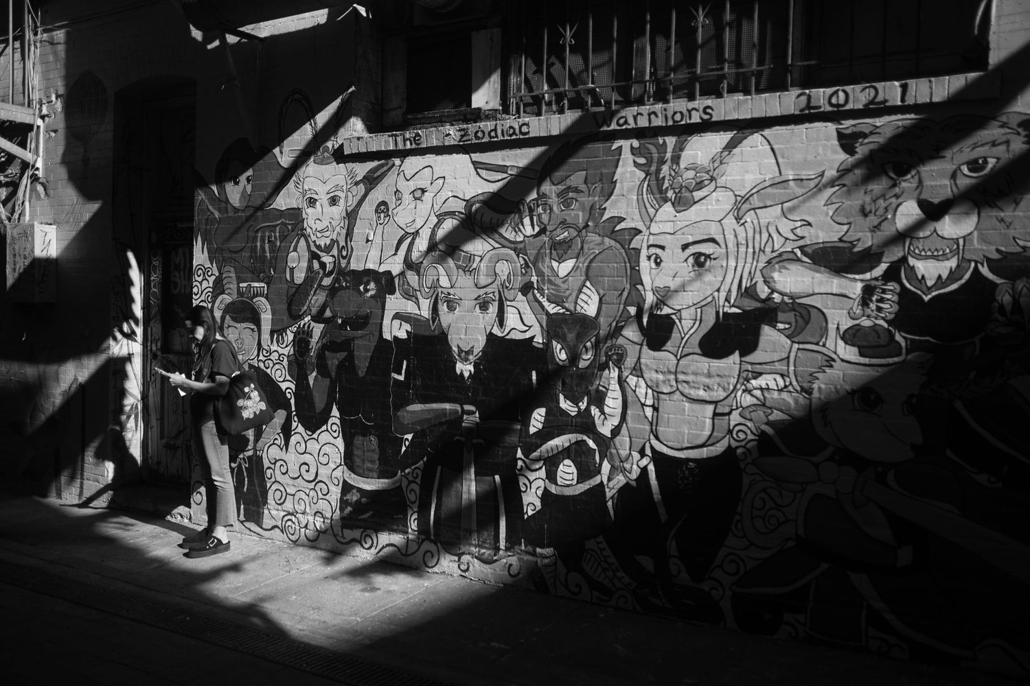 A montage of black and white frames showing animated characters and scenes from a vintage cartoon film or movie reel.